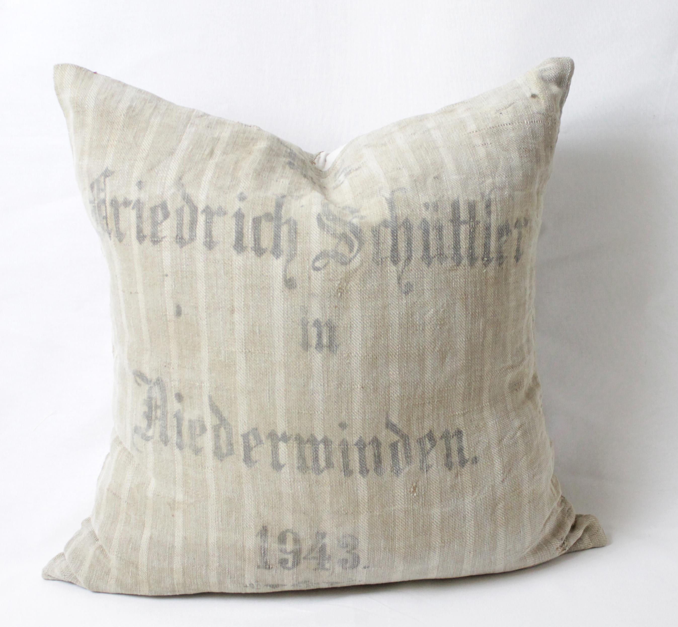 Original printed antique German feed grain pillow. Most of our sacks date back to 1800s to early 1900s. They were handwoven by the farmer's wives with natural hemp and linen. They are marked with beautiful calligraphy or handwriting in tar ink. The