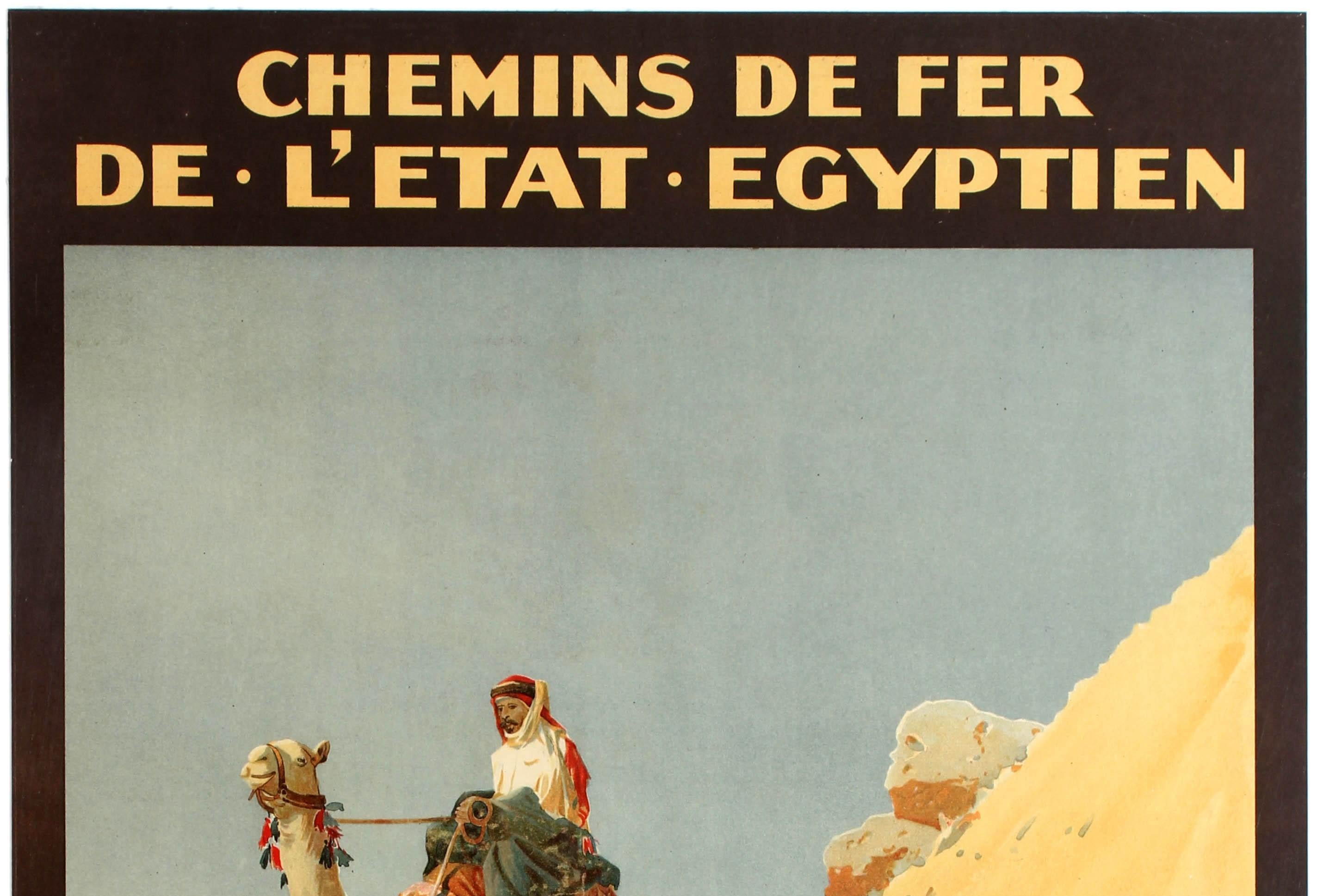 Original antique travel poster advertising the Railway of the Egyptian State featuring a great image by Augustus Osborne Lamplough (1877-1930) of a man riding a camel through the sand in the desert with the text in French above and below reading:
