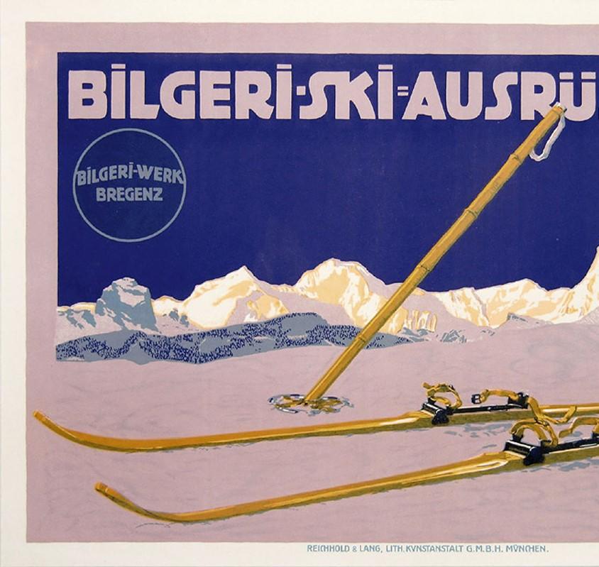 Original antique skiing poster for Bilgeri Werk Bregenz featuring an image of wooden skis and poles in the snow in front of the Alps along the horizon dominated by the Matterhorn mountain peak over Zermatt Switzerland. Bilgeri, the Austrian