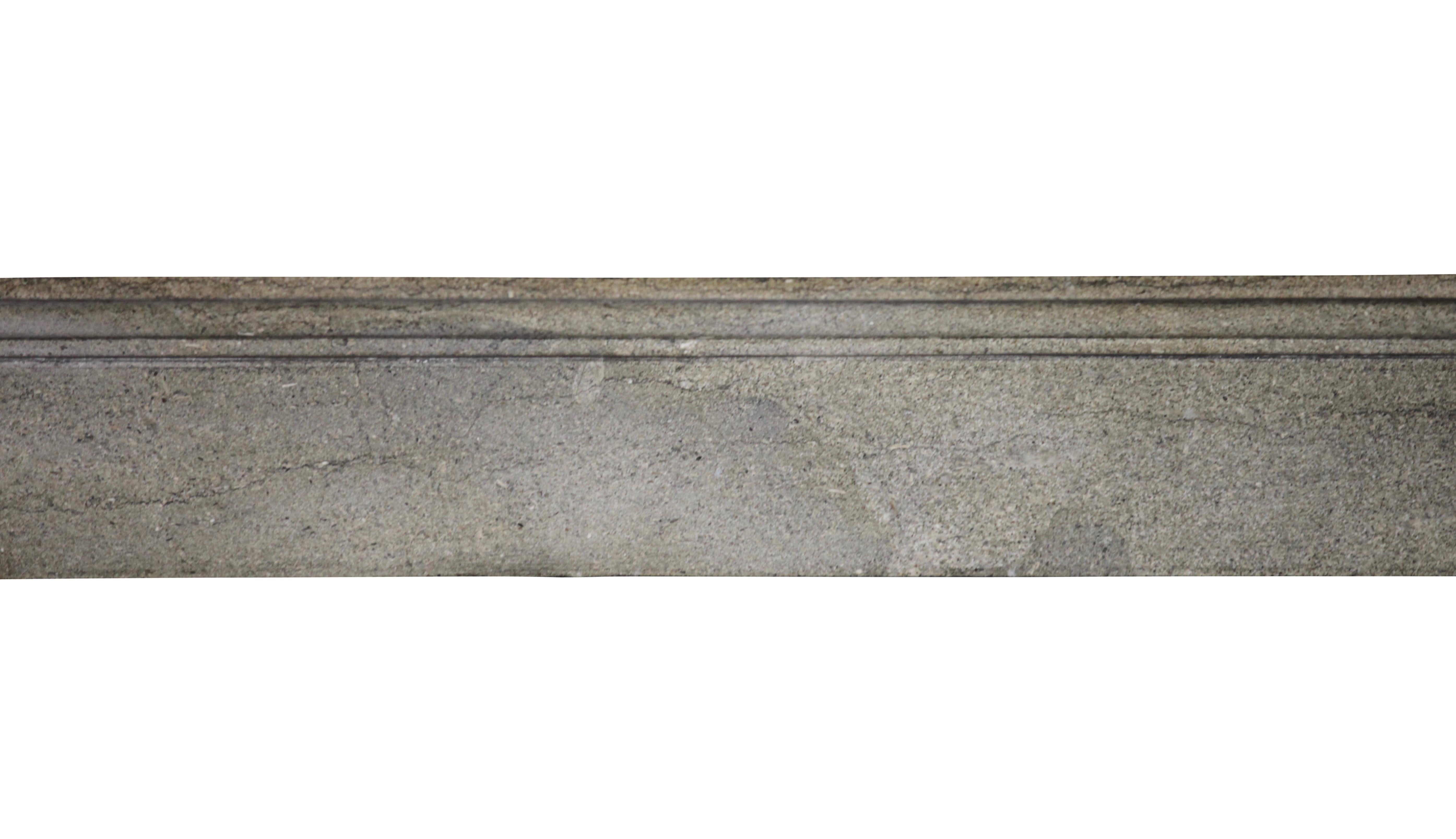 This a French Petite bourguignone fireplace surround in bicolor hard stone
It has a restauration on the top and right of the top shelf. Hard to notice and well restored. It is the kind of fireplace mantel we sell for apartment and timeless to