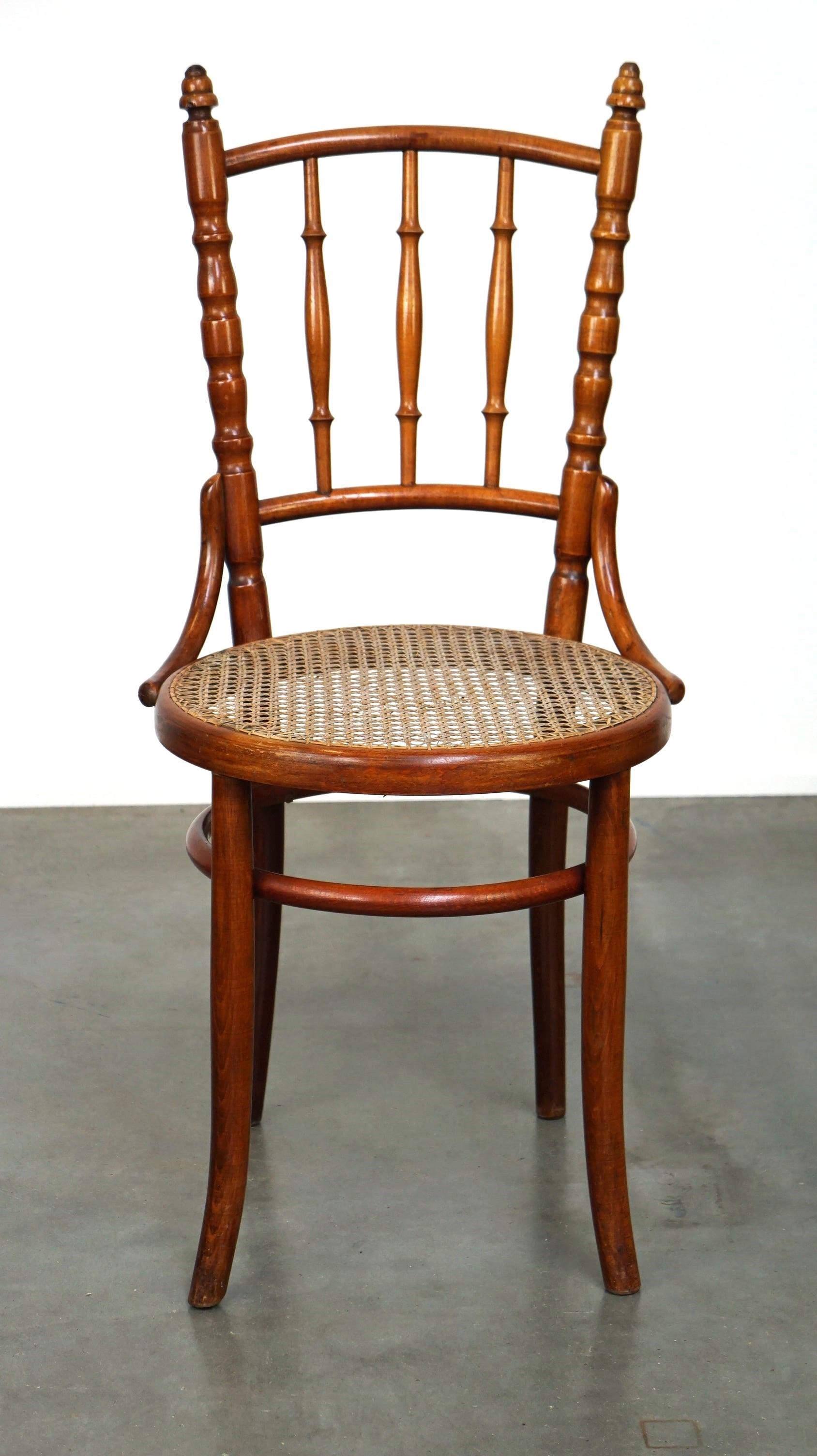 Available: Original Antique Thonet Chair with Gorgeous Colors and Cane Seat
This original antique Thonet chair, produced by Fischel, showcases classic elegance and timeless design. Modeled after Thonet's iconic style, it features a bentwood frame