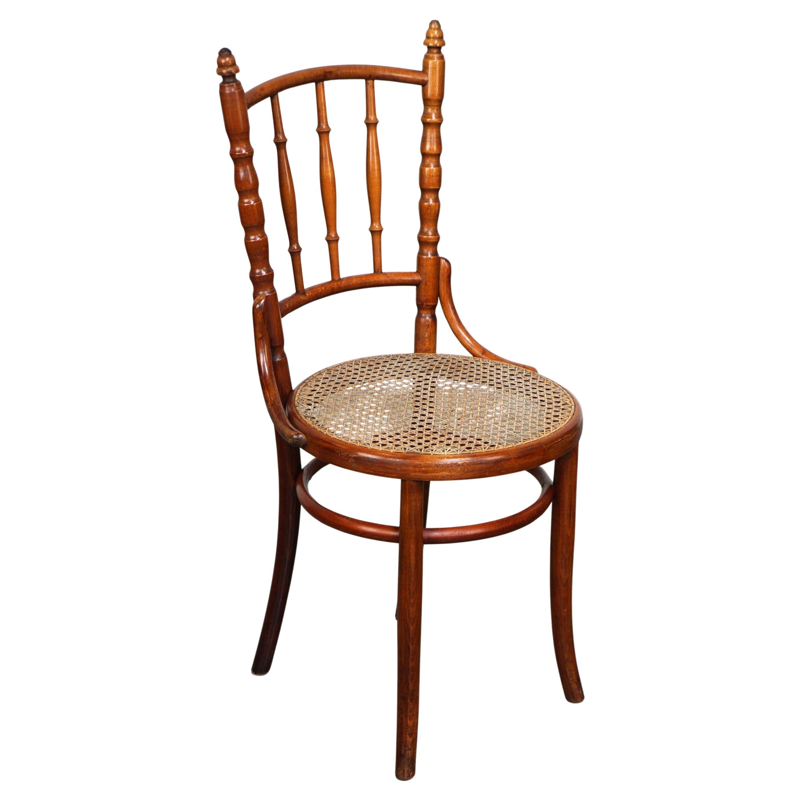 Original antique Thonet chair with great colors and a wicker seat For Sale
