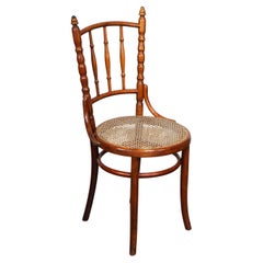 Original antique Thonet chair with great colors and a wicker seat