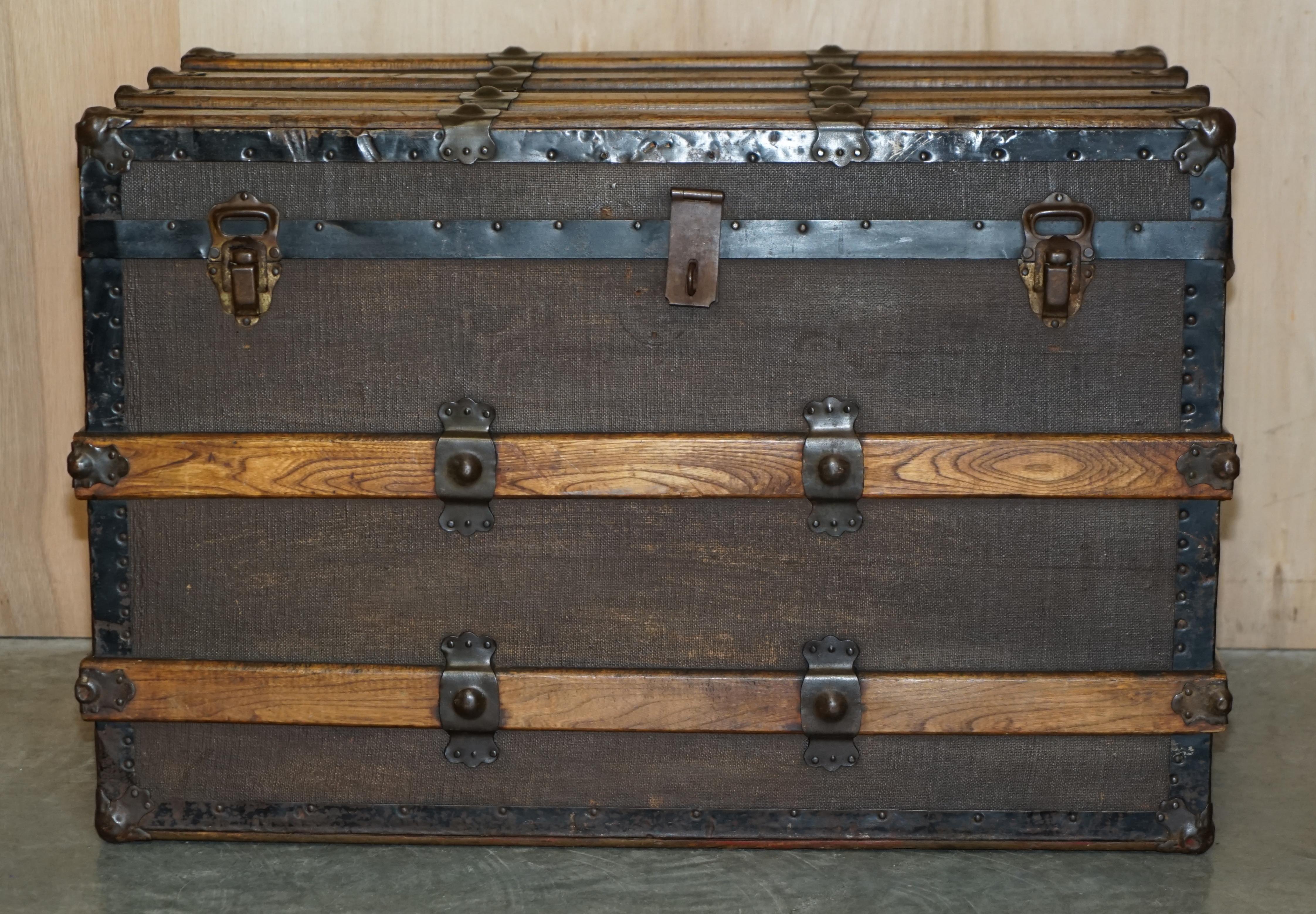 We are delighted to offer for sale this original circa 1880 English Elm strapped with Wrought Iron rivets, leather handled, canvas steamer trunk with period serial number 

This is a very well made example of a steamer trunk designed for luxury