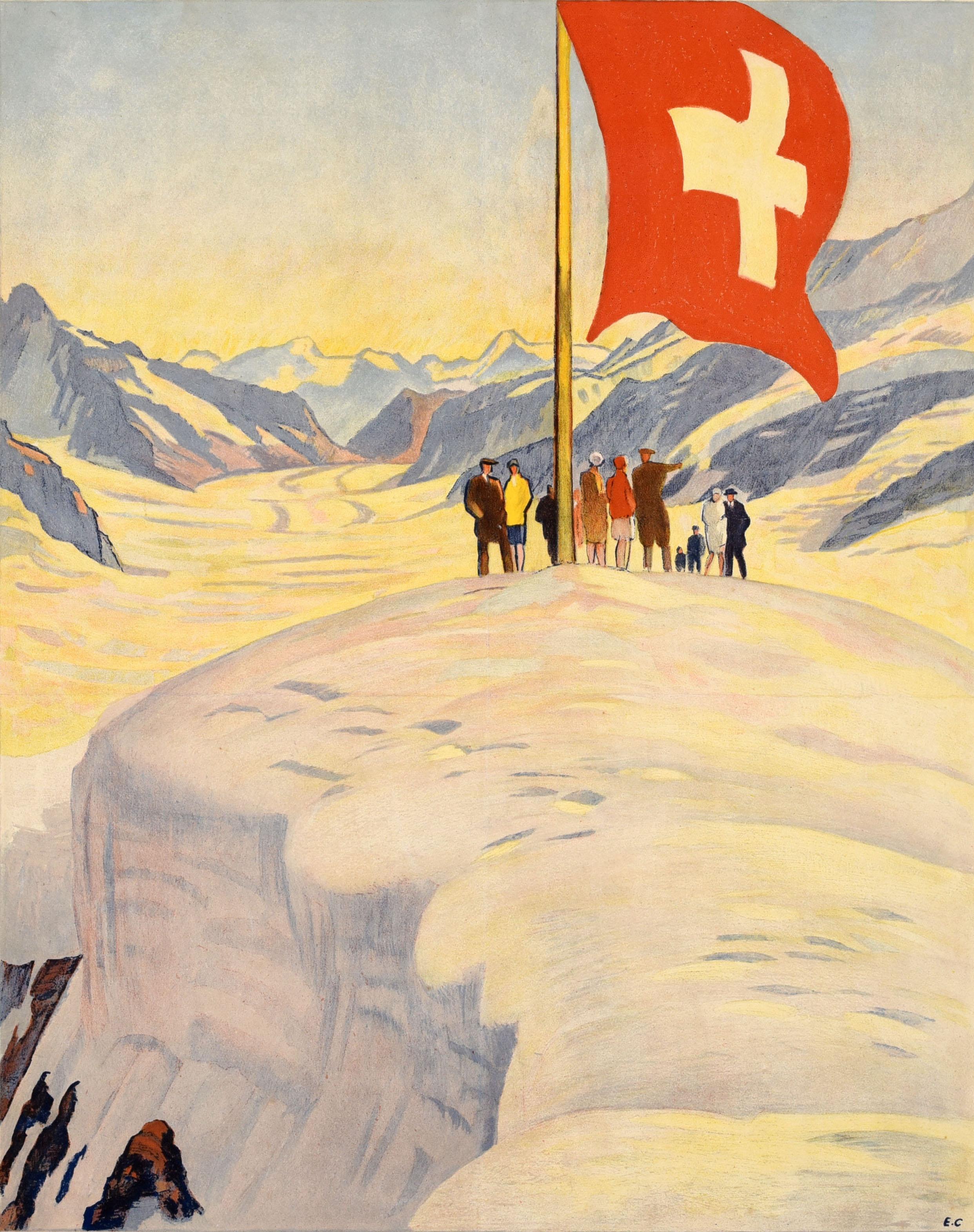 Original antique winter travel poster for the Jungfrau Railway Bernese Oberland Switzerland featuring great artwork by Emil Cardineaux (1877-1936) of a group of people on a snow topped mountain under the Swiss flag with a valley below and mountain