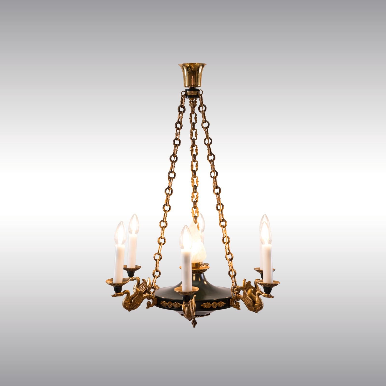 Very decorative chandelier in the style of Empire from the historistic Art Deco Period circa 1920. Stylized swans in gilded and punched casted brass

Suitable for the US.