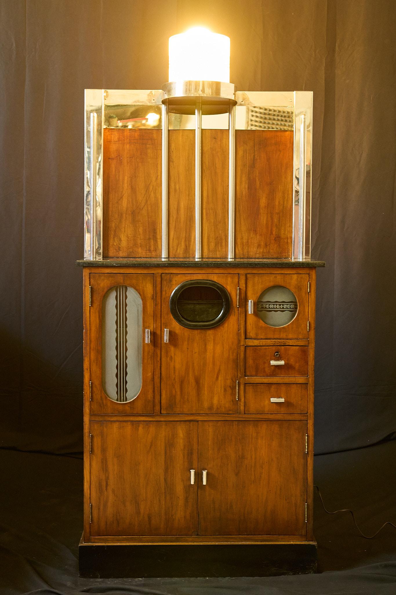 Original Art Deco Barber Station Cabinet from the 1930s. This incredible piece of history showcases the finest of the Art Deco era including a streamlined form, geometric patterns, rich wood grain, and reflective surfaces. It is the ultimate