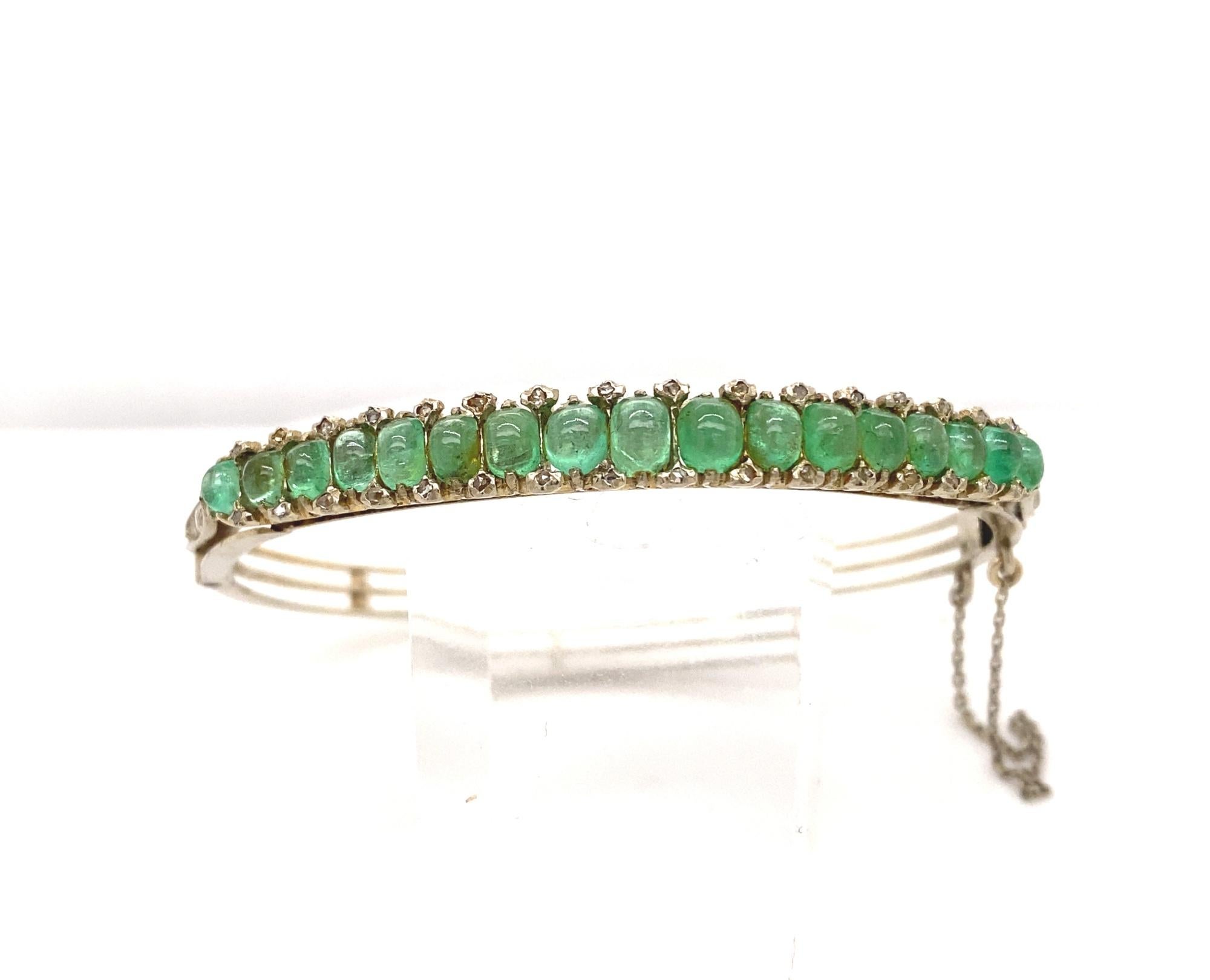 Original Art Deco Cabochon Emerald Diamonds 18K white Gold Bangle. This is a beautiful and rare original cabochon emerald rose cut diamond and 18k white gold bangle bracelet. The bracelet is set with 17 light green natural cabochon emeralds the