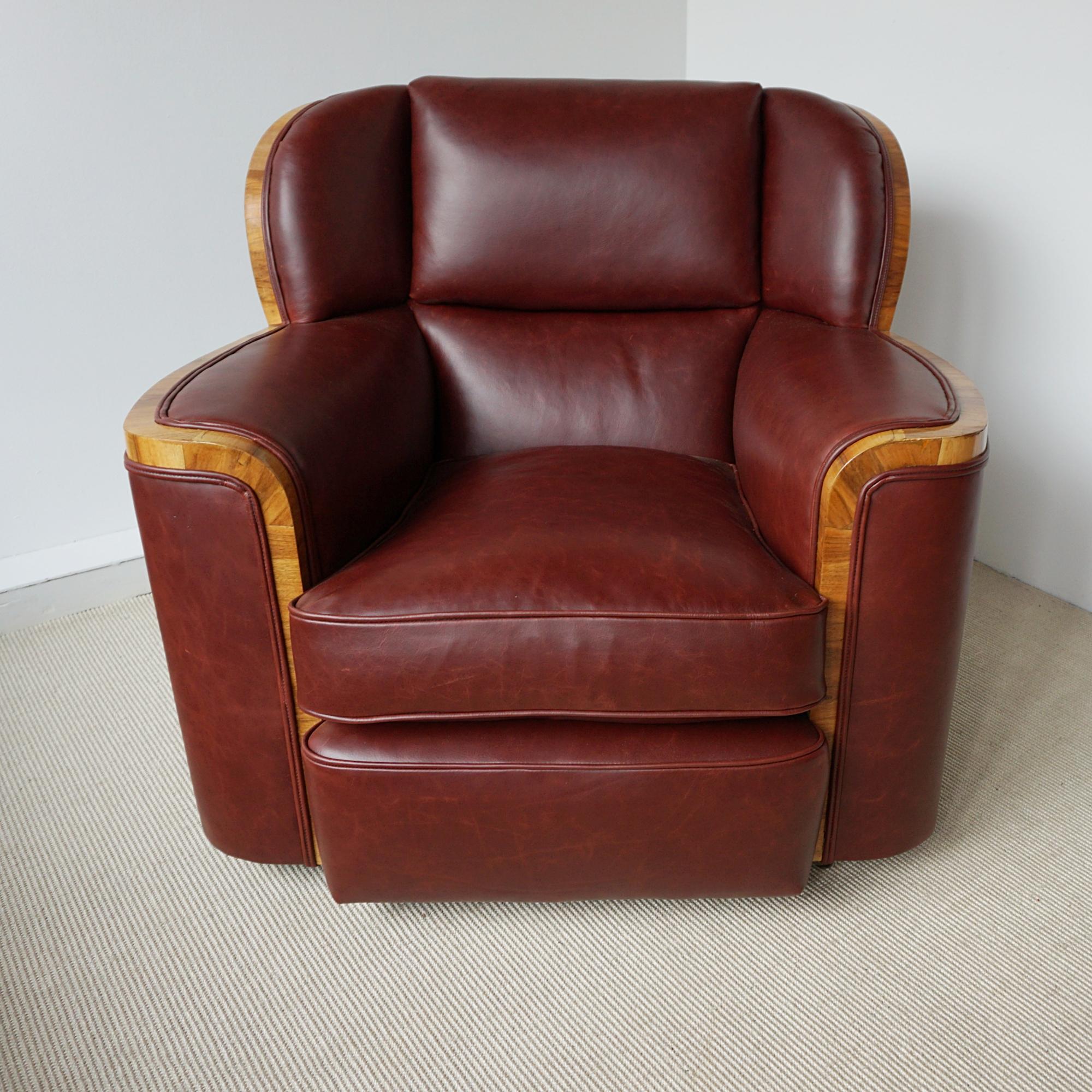 A pair of Art Deco bankers chairs by Harry & Lou Epstein. Figured walnut banding with chestnut leather re-upholstery. 

The Epstein company was founded in London during the 1890’s by Morris Epstein. In the creatively rich metropolis of early 20th