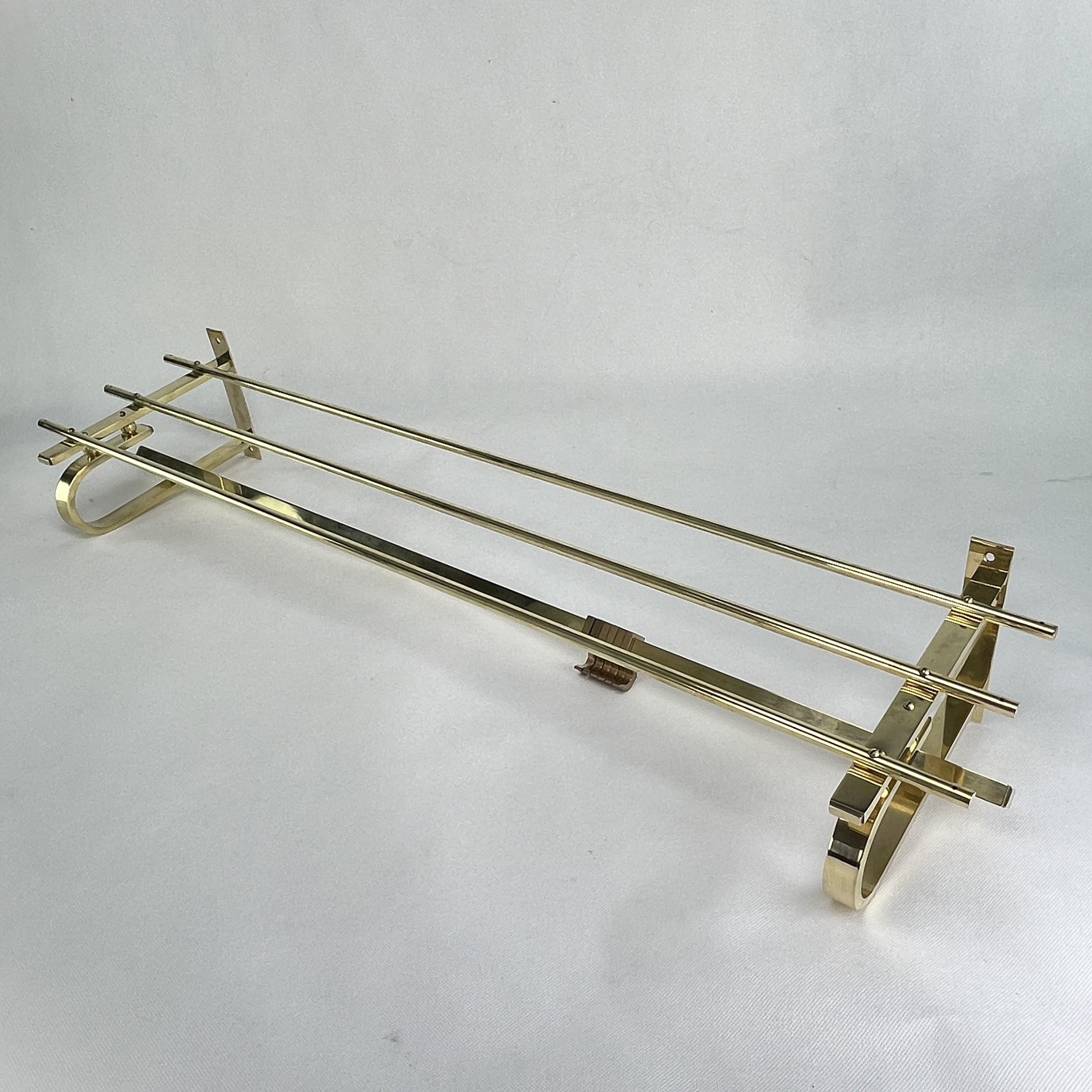 This beautiful vintage wall coat rack from the 1930s is in the streamline modern art deco style. This style emphasized curvy streamlined shapes.

This coat rack has 6 movable hooks to hold your clothes. 

Beautiful timeless antique piece that will