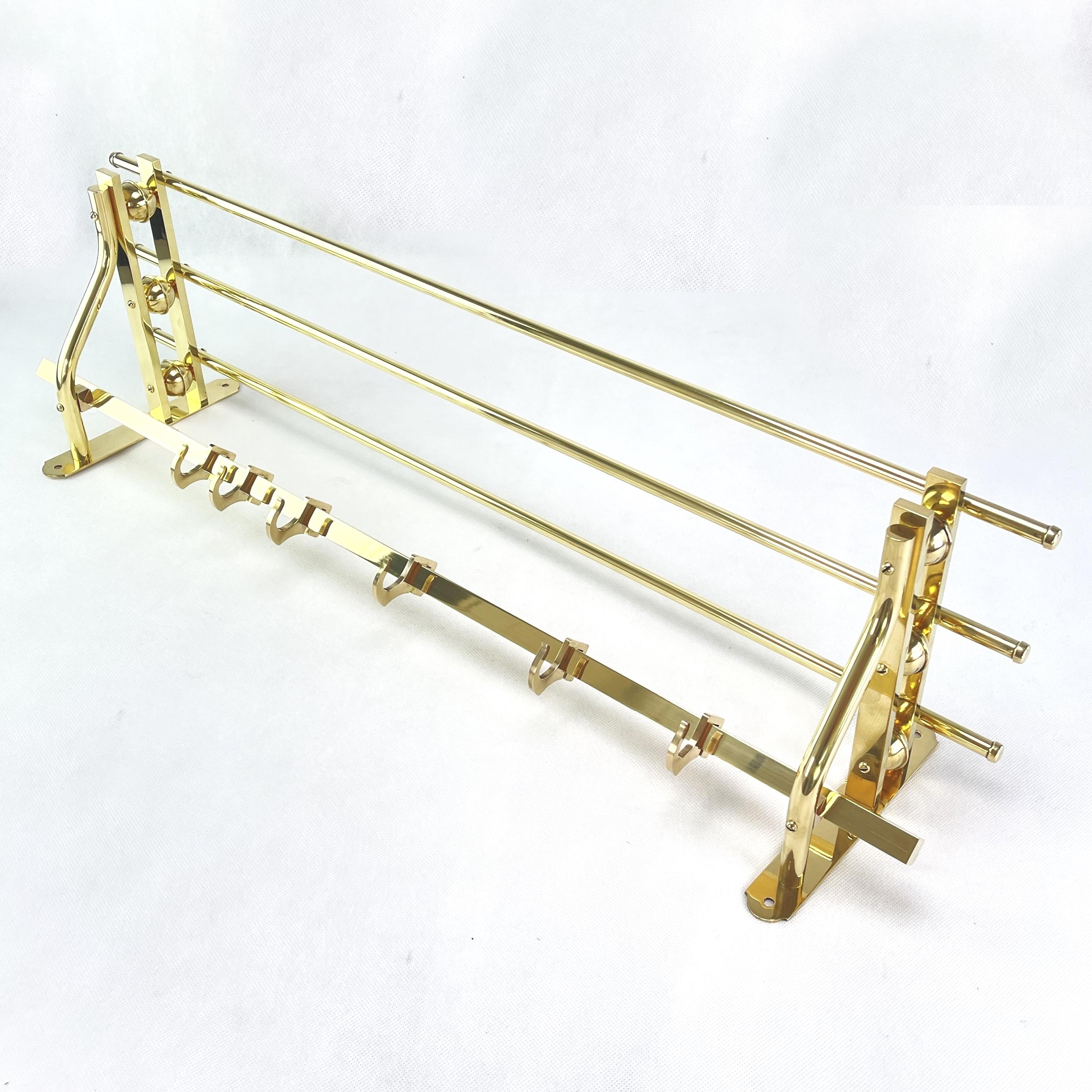 This beautiful wall coat rack from the 1930s is in the streamline modern art deco style. This style emphasized curvy streamlined shapes.

This coat rack has 6 movable hooks to hold your clothes. 

Beautiful timeless antique piece that will leave a