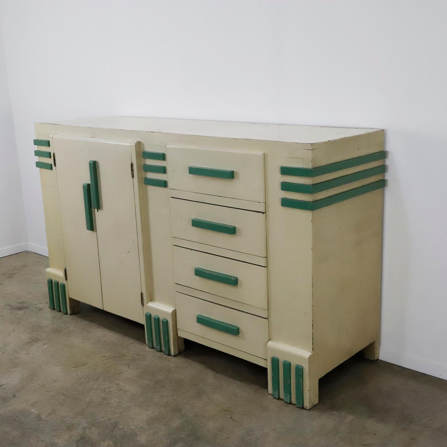 Circa 1930, We offer this Original Mexican Art Deco Credenza. Made in solid pine wood. This piece represents the pure Mexican art deco of the 30's. 