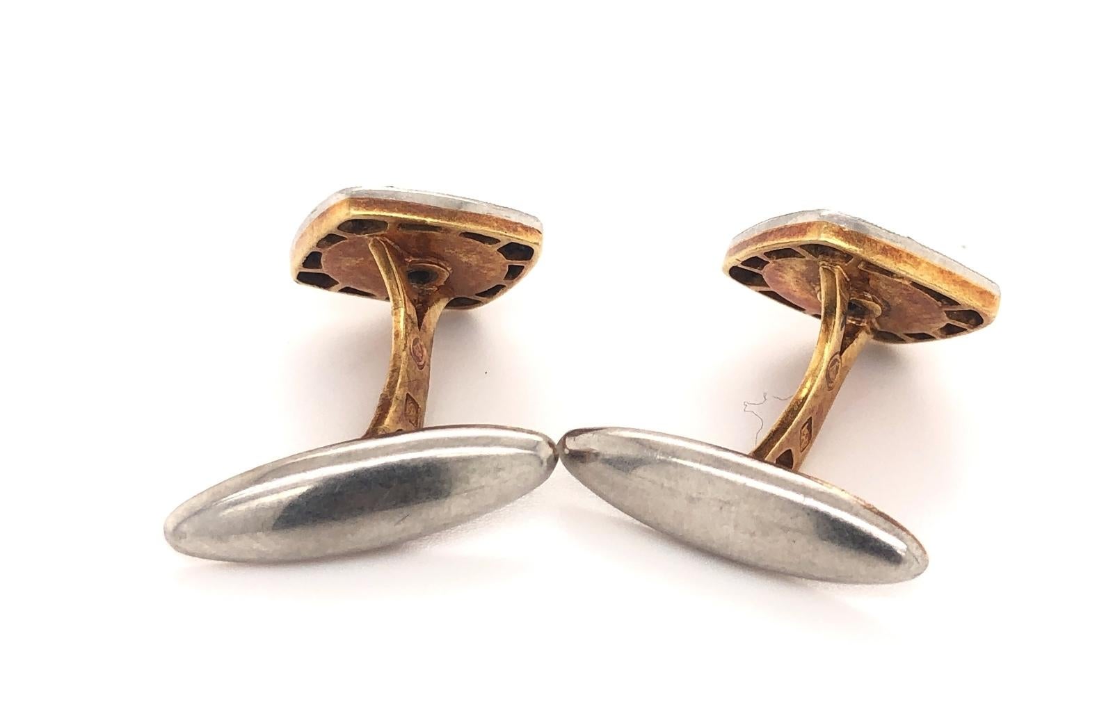 This is a beautiful pair of original art deco c.1930 platinum and 18k gold cufflinks with natural sapphires and diamonds. The cufflinks are marked 18K with makers marks. The 40 custom cut sapphires are natural blue gem quality. The two old mine cut