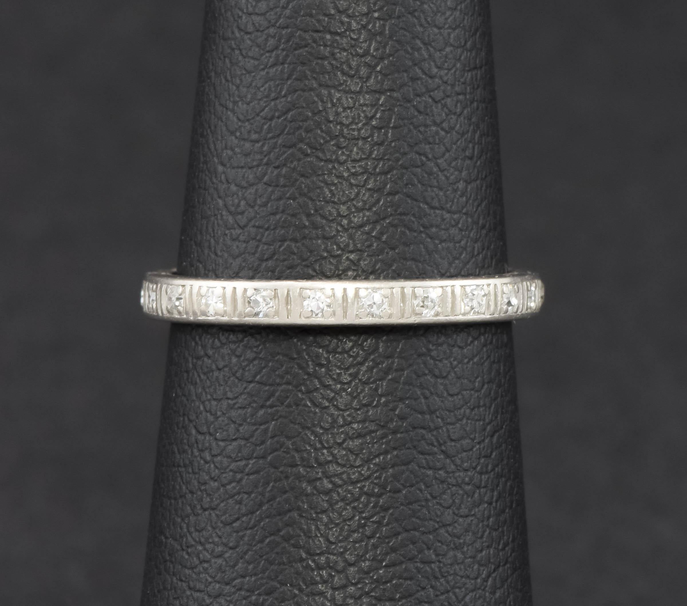 Offered is an original full eternity diamond wedding band ring dating to the Art Deco period.

Featuring 20 sparkly old single cut diamonds bead-set around the slender platinum band, the total estimated carat weight is approximately .165 carats. 