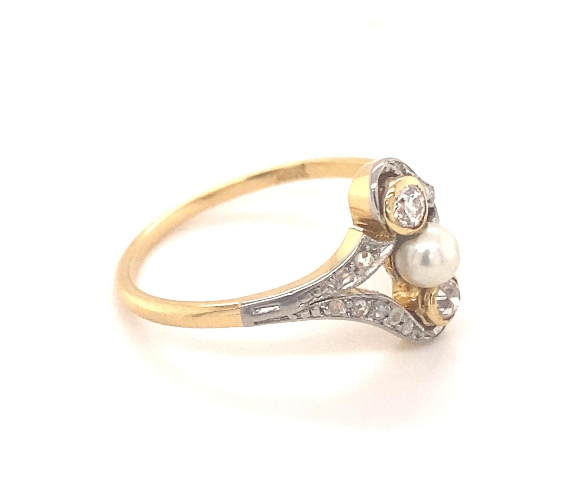 Original Art Deco Diamond Pearl Platinum 18k Yellow Gold Ring. This is a beautiful art deco pearl old mine cut diamond set in platinum 18k yellow gold ring. The center pearl measures 4mm and has nice luster. On the two sides of the pearl are 2 old