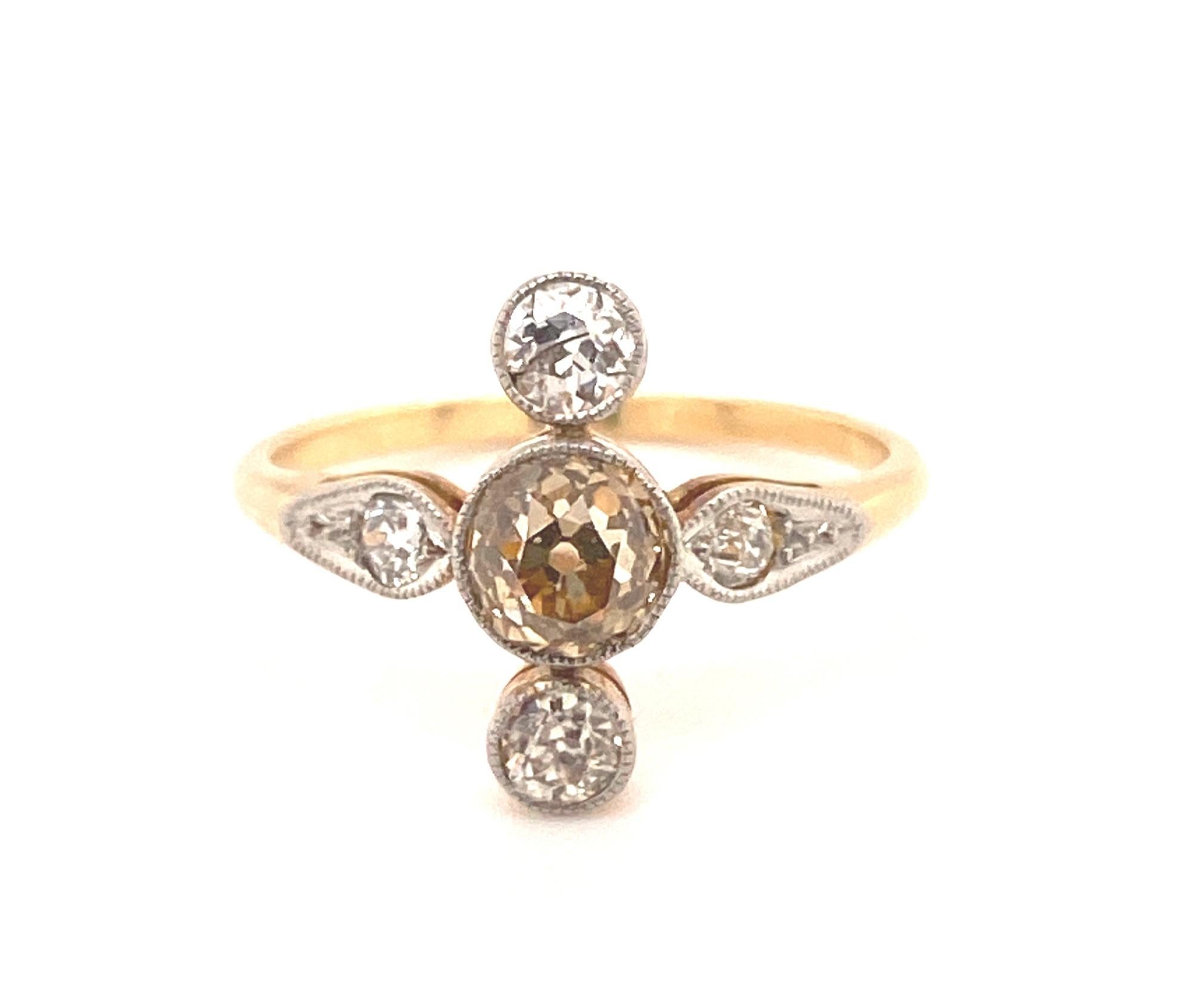 Original Art Deco Fancy Cognac White Diamonds 18K Yellow Gold Ring. This ring has a beautiful and unique design c.1930s. In the center it is set with a .65 carat old mine fancy cognac diamond VS-2 clarity. There are 4 additional old mine cuts that