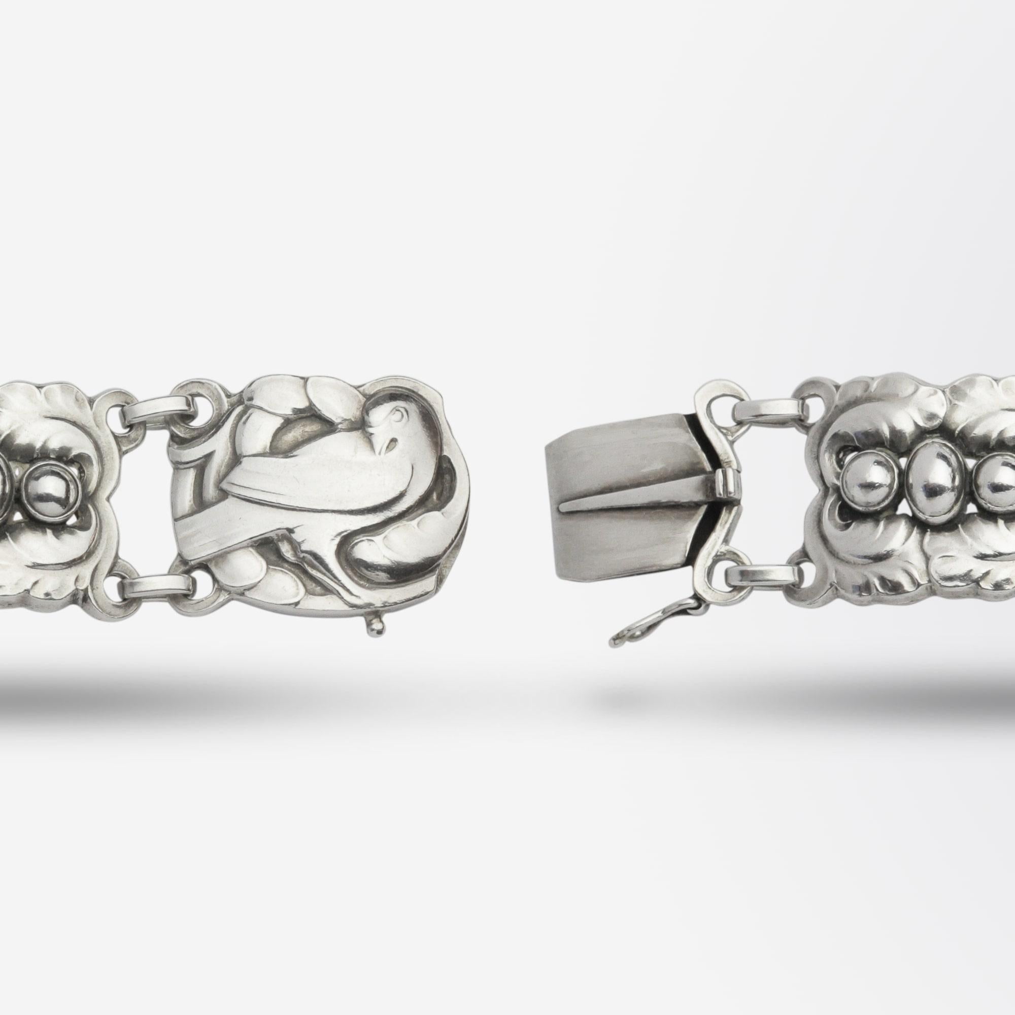 An early sterling silver bracelet in pattern '#14' by Kristian Mohl-Hansen for Danish jeweller Georg Jensen. The beautifully made sterling silver piece was handcrafted in Denmark and has a Georg Jensen hallmark for the period 1910-1925. There is a