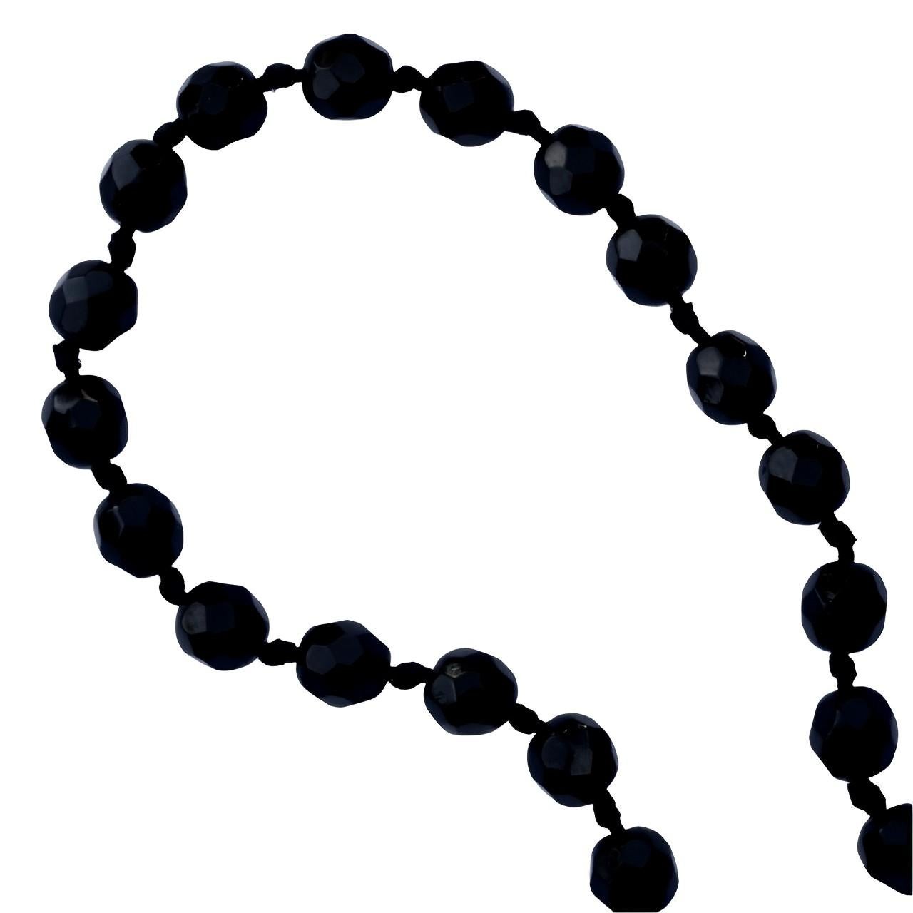 Classic Art Deco long french jet beads flapper necklace with a barrel clasp. The lovely faceted beads are hand cut and hand knotted. Measuring length 132 cm / 52 inches, and the beads are 6.5 mm / .25 inch. The necklace is knotted between each bead