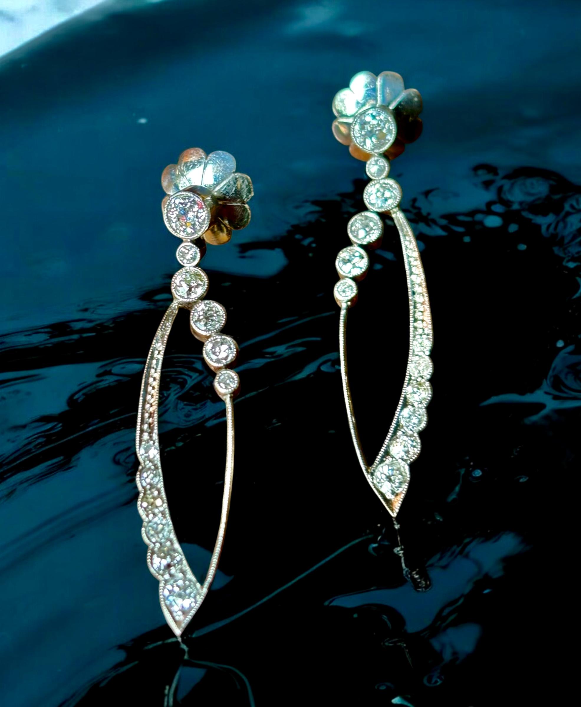 Original Art Deco Long Platinum and Diamond Dangle Earrings, Circa 1925.
Stunning and spectacular, gorgeous and glamorous, 1 9/16 inches long Art Deco dangling diamond earrings, A fabulous pair of diamond and platinum earrings that are typical of