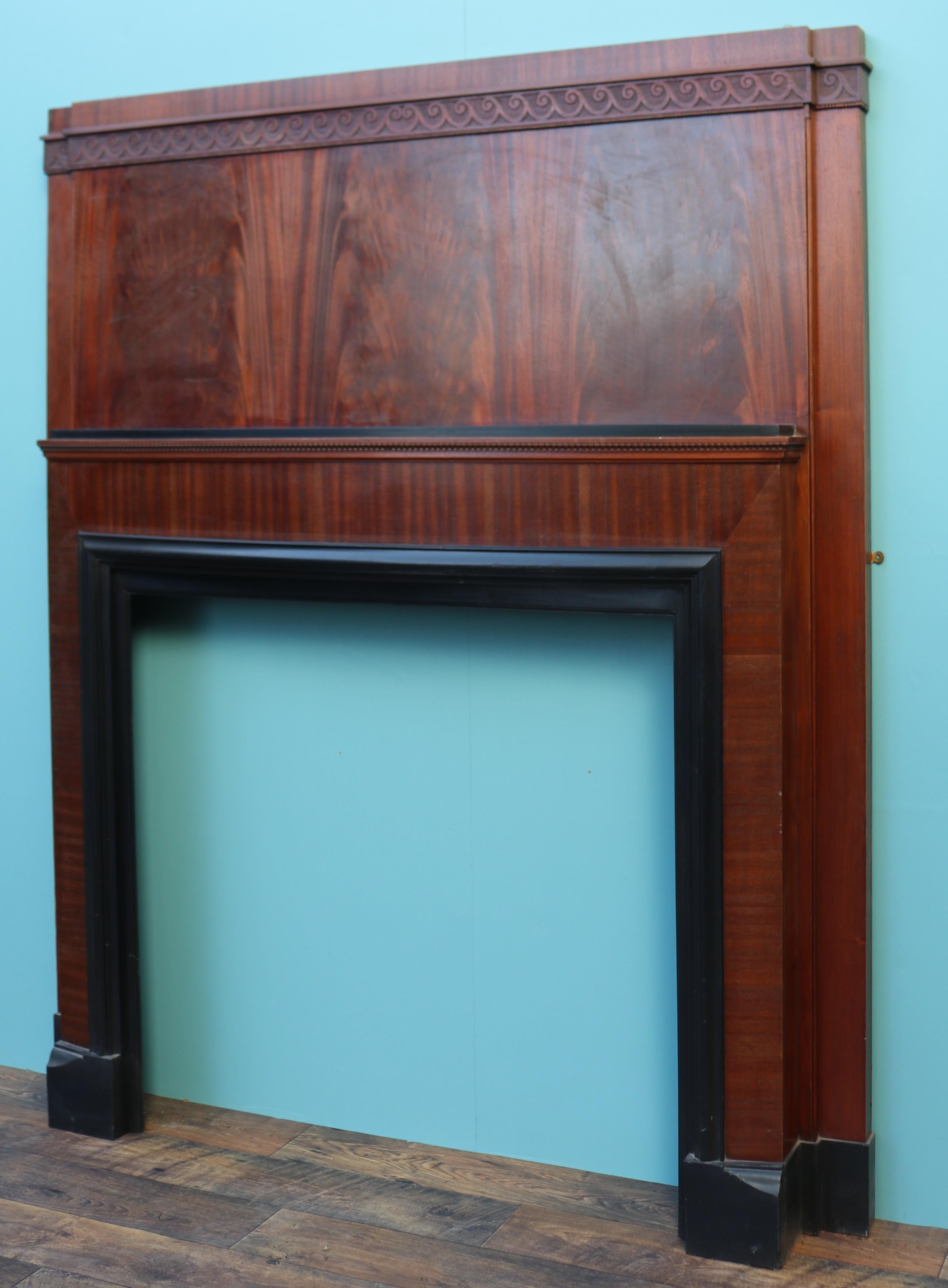 A large Art Deco fireplace veneered in flame mahogany, with painted matt black shelf and trim.

Additional Dimensions:

Opening height 101 cm

Opening width 105.5 cm