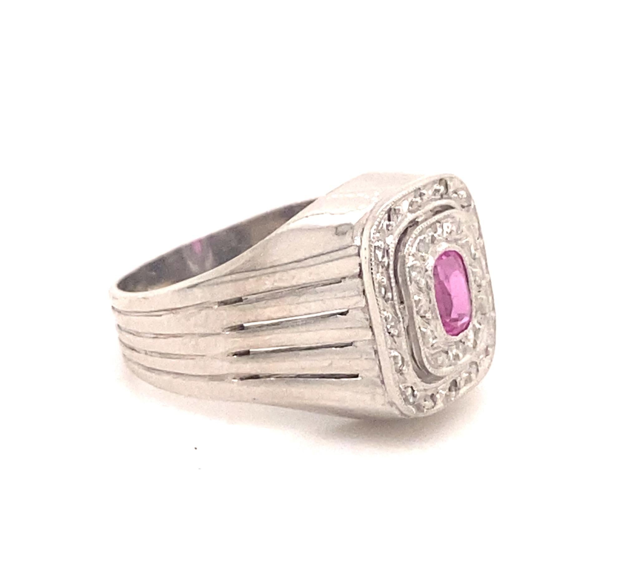 Stunning original Art Deco ring c.1930 set with an oval shaped pink tourmaline and rose cut diamonds in 18K white gold.  The natural pink tourmaline has amazing color and clarity estimated weight .30 carats. There are 30 rose cut diamonds I color