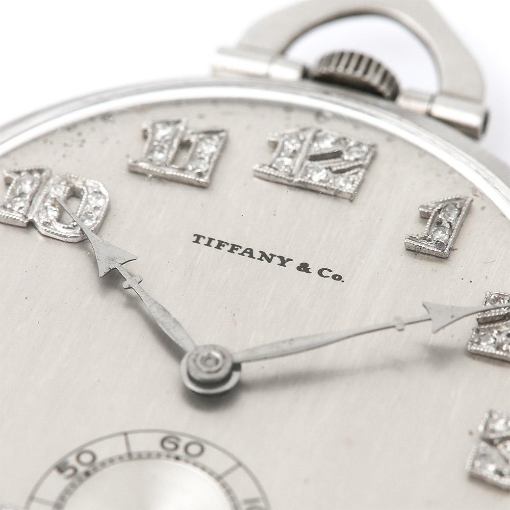 A fabulous platinum and diamond Art Deco gents pocket watch circa 1930 made by Tiffany & Co. of New York. This is a circular open faced pocket watch with a brushed silver coloured dial with a subsidiary second dial, millegrain set white Arabic