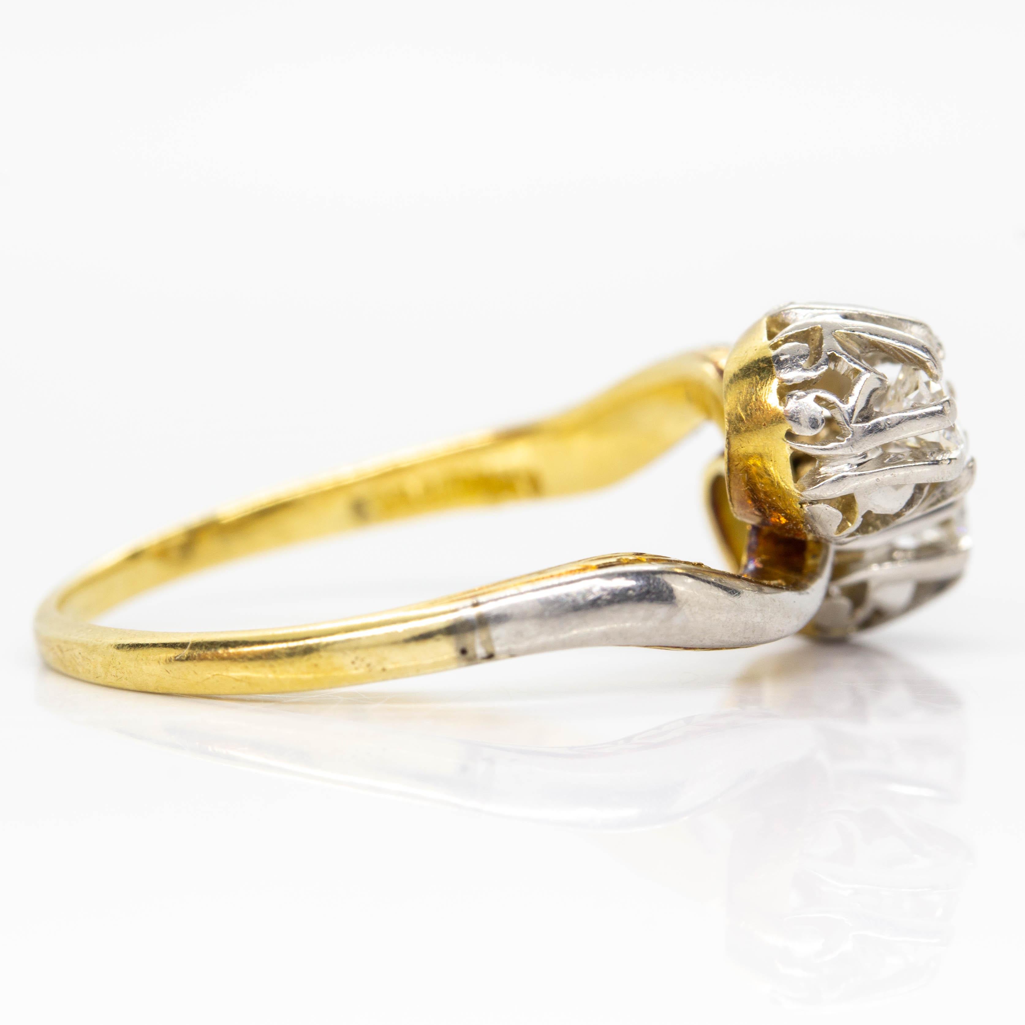 Period: Art Nouveau (1890-1919)
Composition: 18K Gold and Platinum
•	2 old European cut diamonds H-SI1 0.30ctw
Ring size: 5 ½ 
Ring face measure: 10mm by 12mm 
Rise above finger: 6 mm
Total weight: 3.3 grams – 1.9dwt
