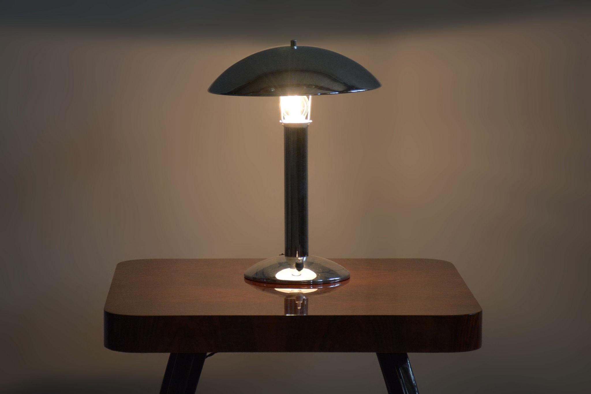 Original ArtDeco Table Lamp. Fully Functional Electrification.

Material: Chrome-plated Steel
Source: Czechia (Czechoslovakia)
Period: 1930-1939

The chrome parts have been cleaned and professionally restored. 

This item features classic Art Deco