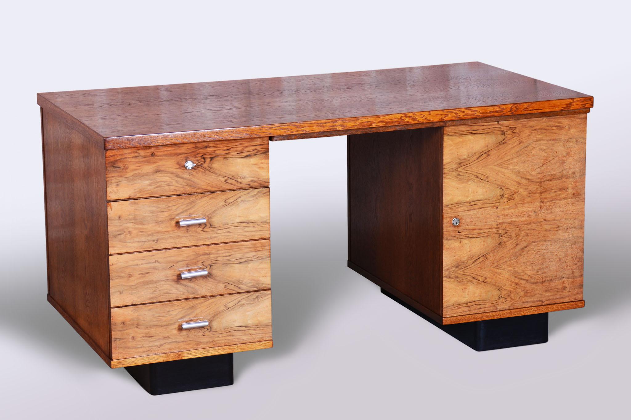 Desk dimensions:
Height: 76 cm (29.9 in)
Width: 150 cm (59.1 in)
Depth: 76 cm (29.9 in)

Leg space
Height: 71 cm (28 in)
Width: 54 cm (21.3 in)

This Art Deco writing desk, designed by Jindřich Halabala for UP Závody, dates back to the early 20th