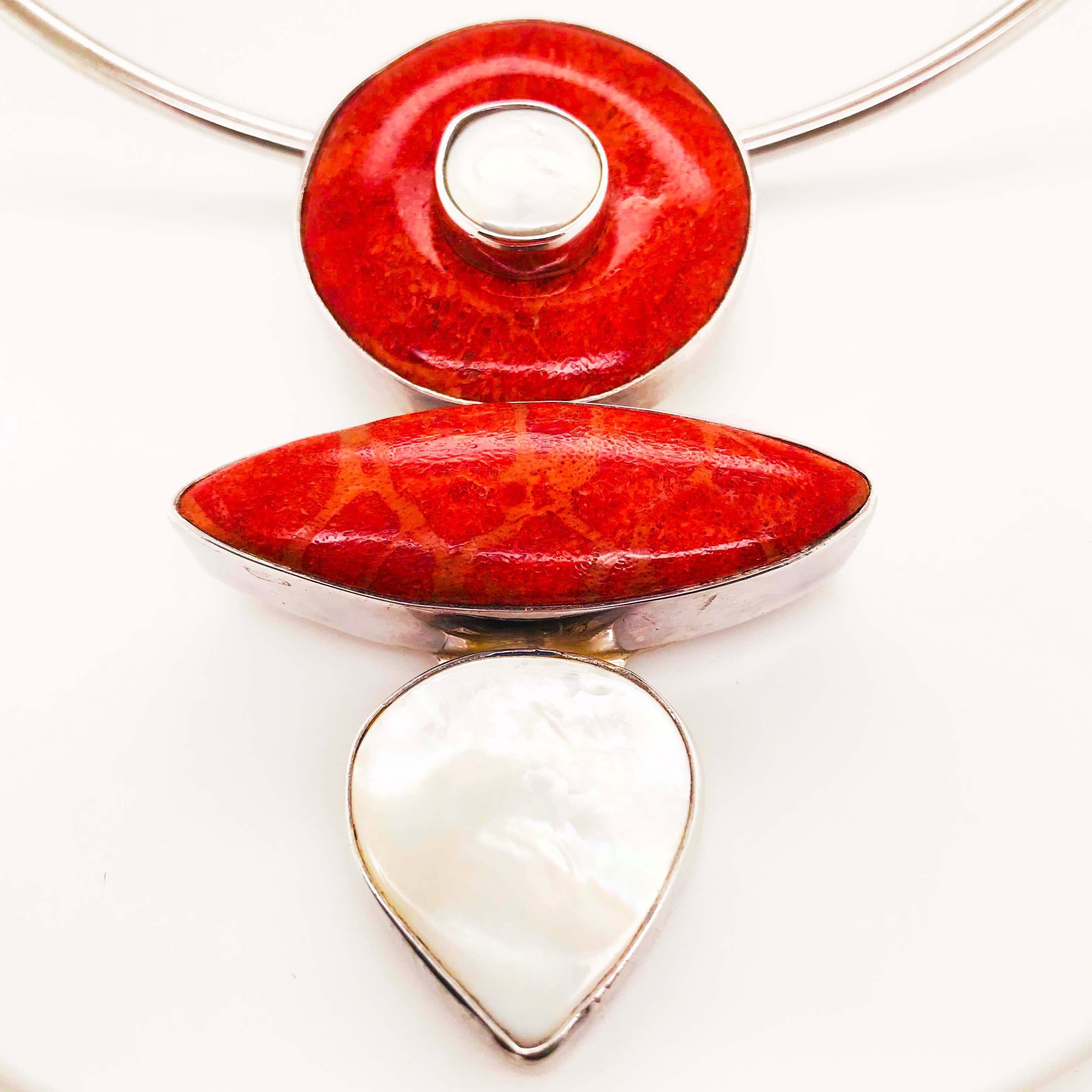 This stunning sponge coral and Mother of Pearl Arts & Crafts necklace is a unique, bold piece that is striking! The necklace has a sterling silver cuff necklace choker that is 3.45 millimeters wide with a 5.5 inch diameter. This sterling silver