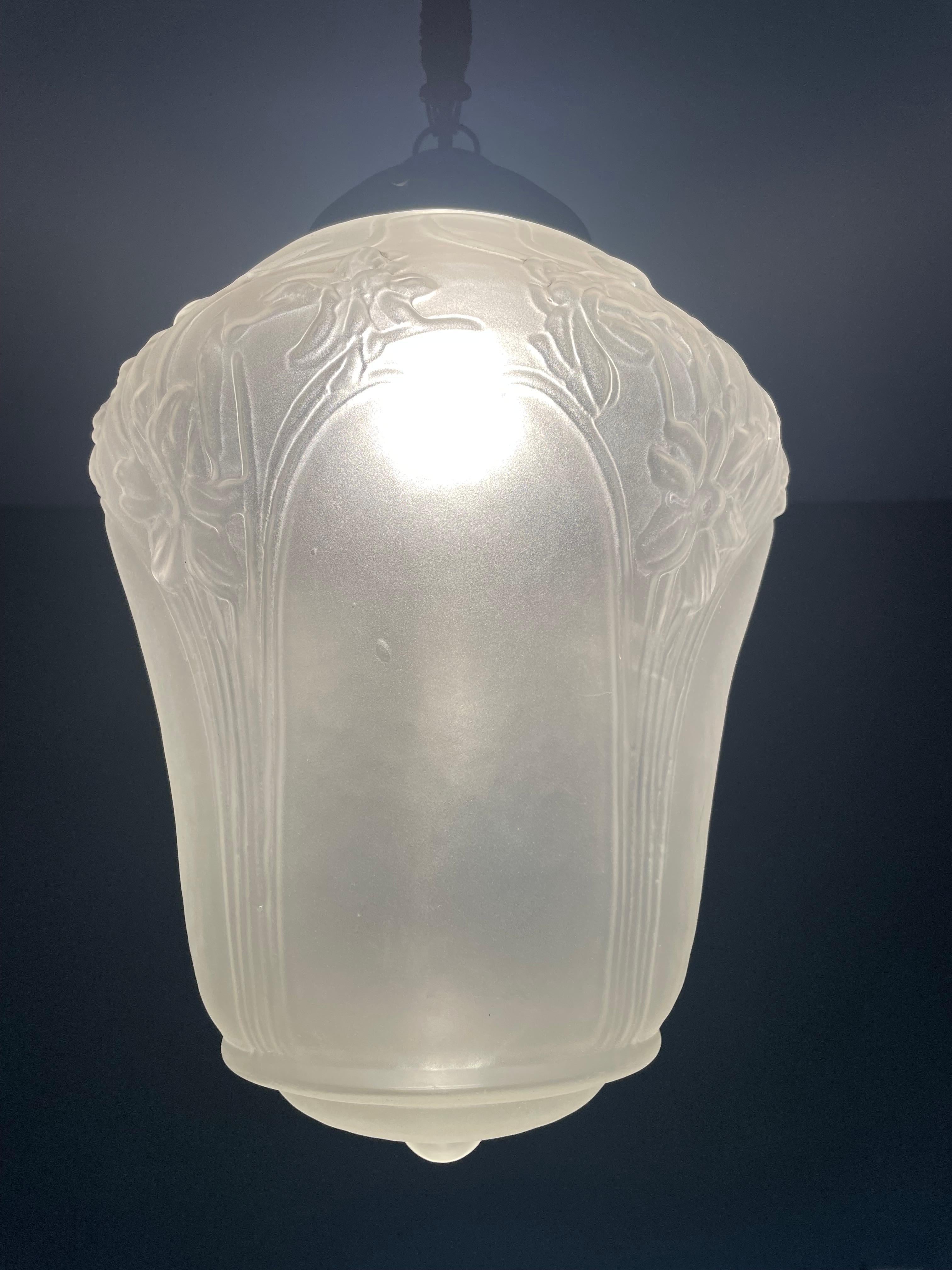 All original and aesthetically perfect glass and brass pendant.

With early 20th century light fixtures as one of our specialities, we are always thrilled to find antique pendant lights that we have never seen before. This superb condition Arts and