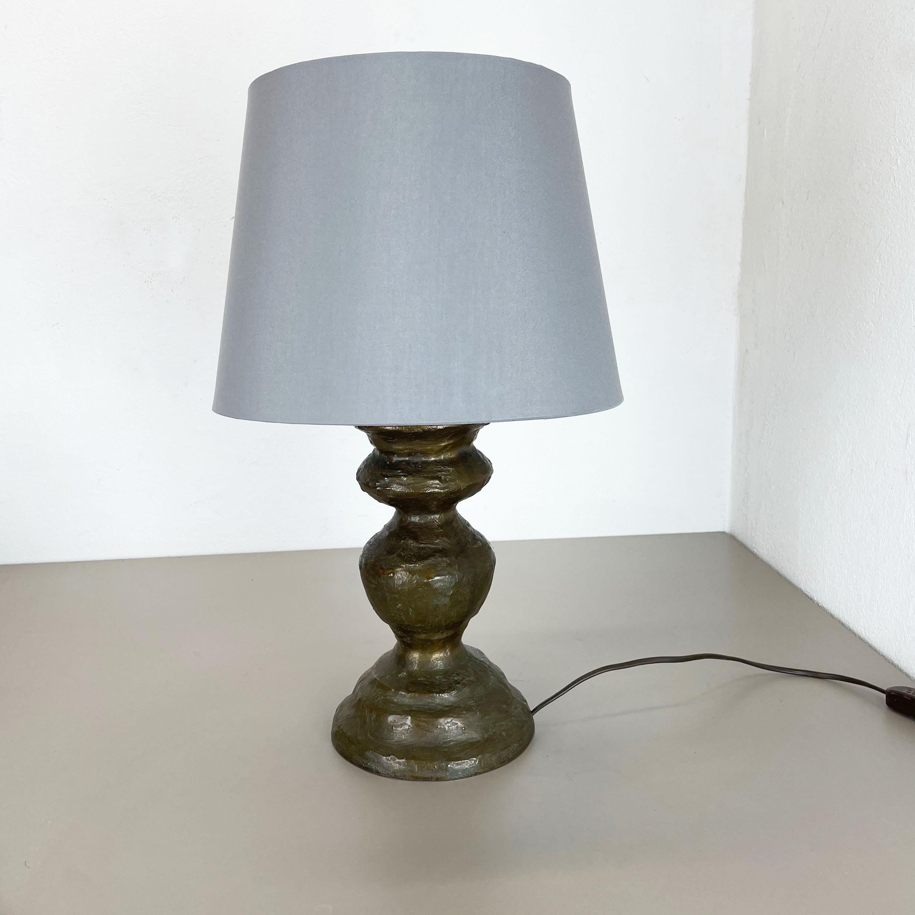 Article:

table light


Origin:

Austria


Age:

1960s


This original vintage table light was designed and produced in the 1960s in Austria. The super rare and Minimalist light stand element has a unique brutalist form and is made of