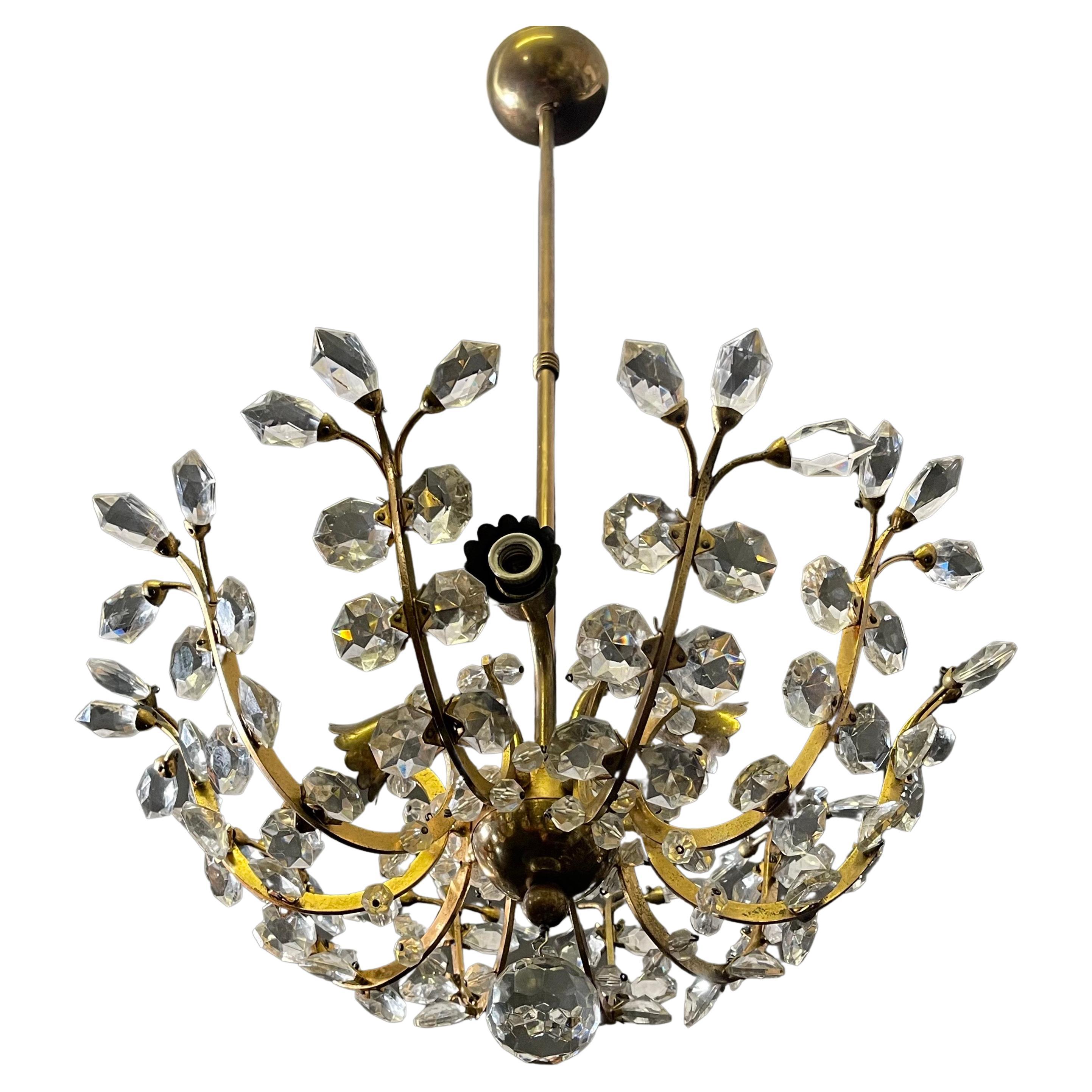 A lovely, gilt brass and cut-glass three-light chandelier by Oswald Haerdtl for Lobmeyr, Austria, Vienna, circa 1960s.
Socket: 3x E14 (Edison) for standard screw bulbs.
 