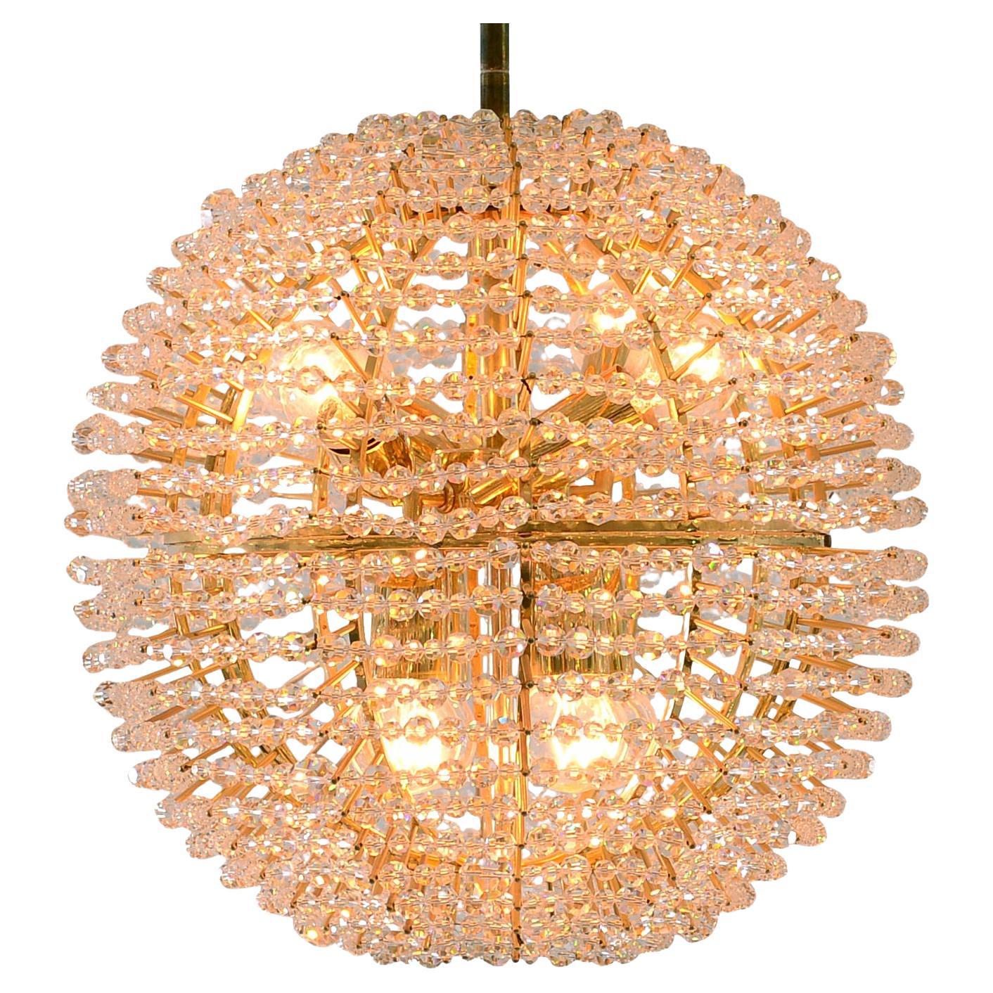 A fireball like chandelier, made in the 1960s by Vienna based company Bakalowits. Eight-flames, the total drop is to be determined. Hundreds of handcut strass glass stones are thread to a ball
Suitable for the US market.