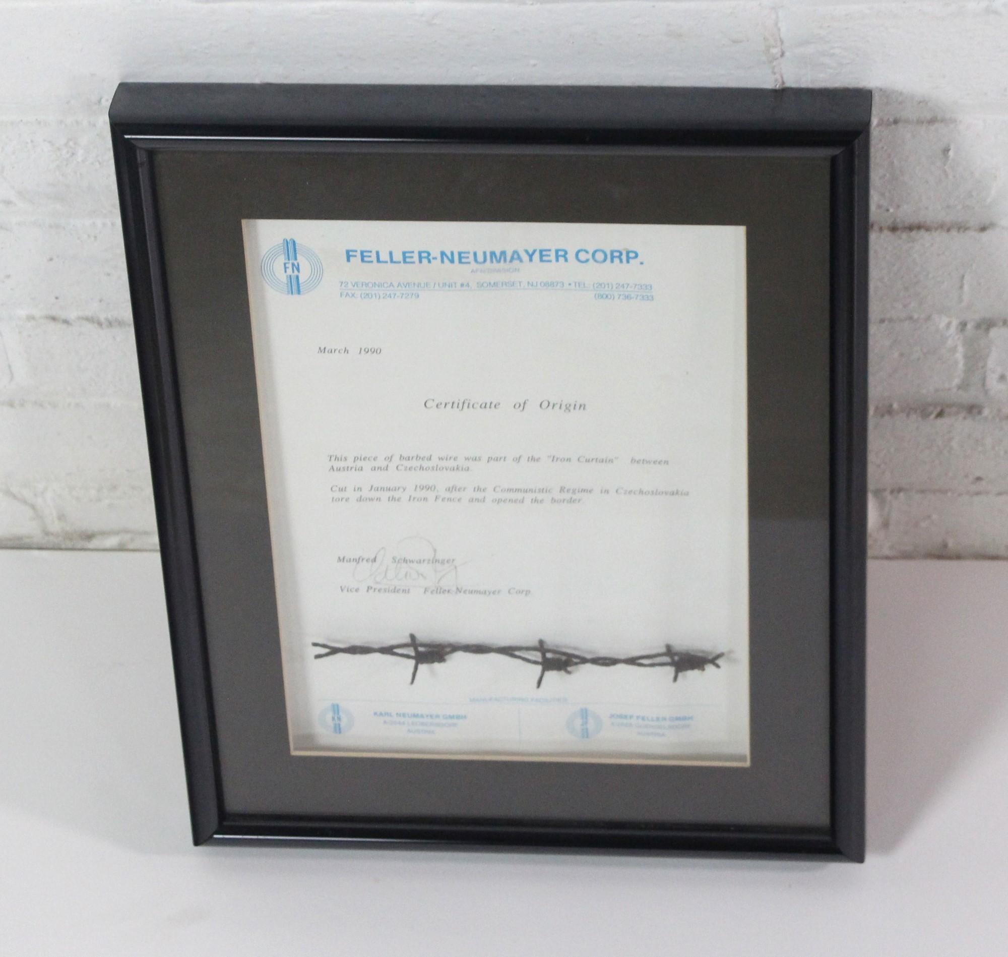 Original piece of barbed wire of the Iron Curtain that was installed between Austria and Czechoslovakia. Certificate of Origin dates is from March 1990. Wood frame. This can be seen at our 400 Gilligan St location in Scranton, PA.