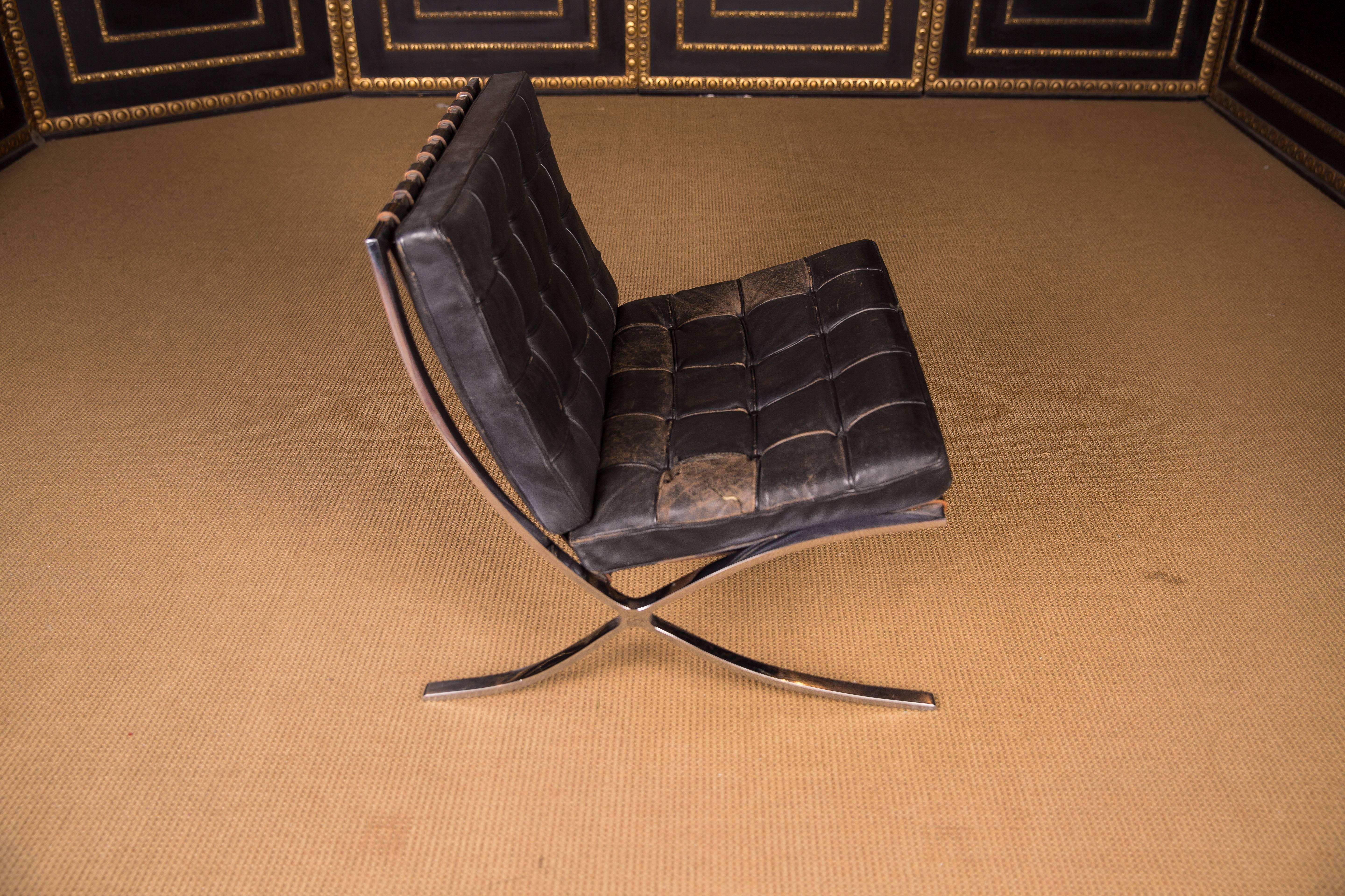 The armchair is from the 1960s-1970s. The leather is not in a good state.

Barcelona chair 