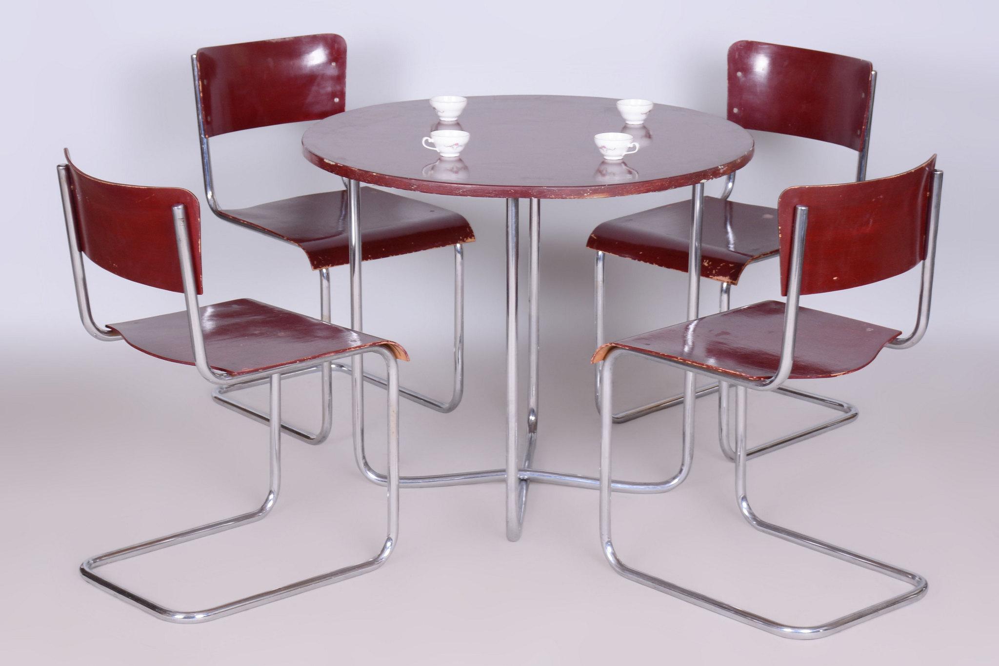 Dining table and 4 Chairs

This elegant dining set from the Bauhaus period was crafted in Czechoslovakia by the renowned company Hynek Gottwald. The set includes a dining table and four chairs, showcasing the minimalist aesthetics and functional