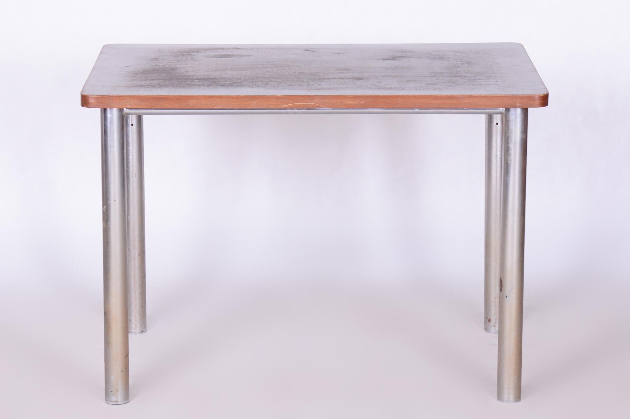 Original Bauhaus table

Period: 1930-1939
Source: Czechia
Material: Chrome-Plated Steel, Walnut, Polish 

Original well preserved condition.

In pristine original condition, the item has been professionally cleaned, and its polish has been revived