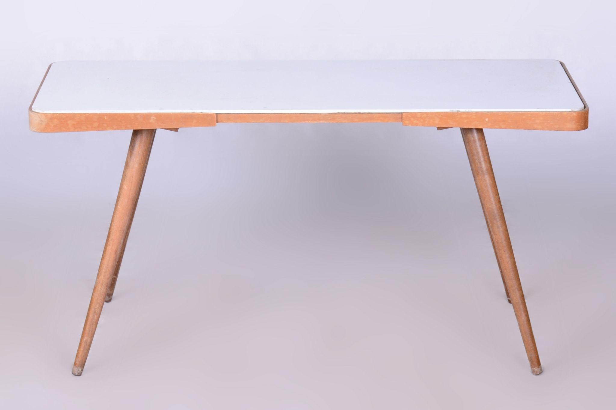Original Coffee Table by Interier Praha.

Maker: Interier Praha
Period: 1960-1969
Source: Czechia (Czechoslovakia)
Material: Beech, Opaxit Glass

Well-preserved condition. Reived polish.

Made by Interier Praha, the state furniture company in