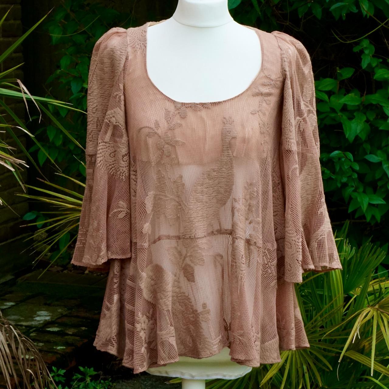 Wonderful original Biba pinkish beige flared mesh top, with a beautiful peacock and floral design, and the dark gold Biba label. It has a scoop neck and wide flared sleeves, the front is partially lined. There are no fastenings.

This is a really