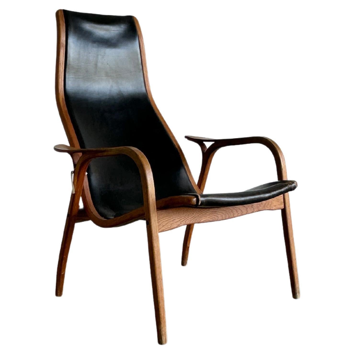 Original black leather Lamino lounge chair by Yngve Ekström for Swedese