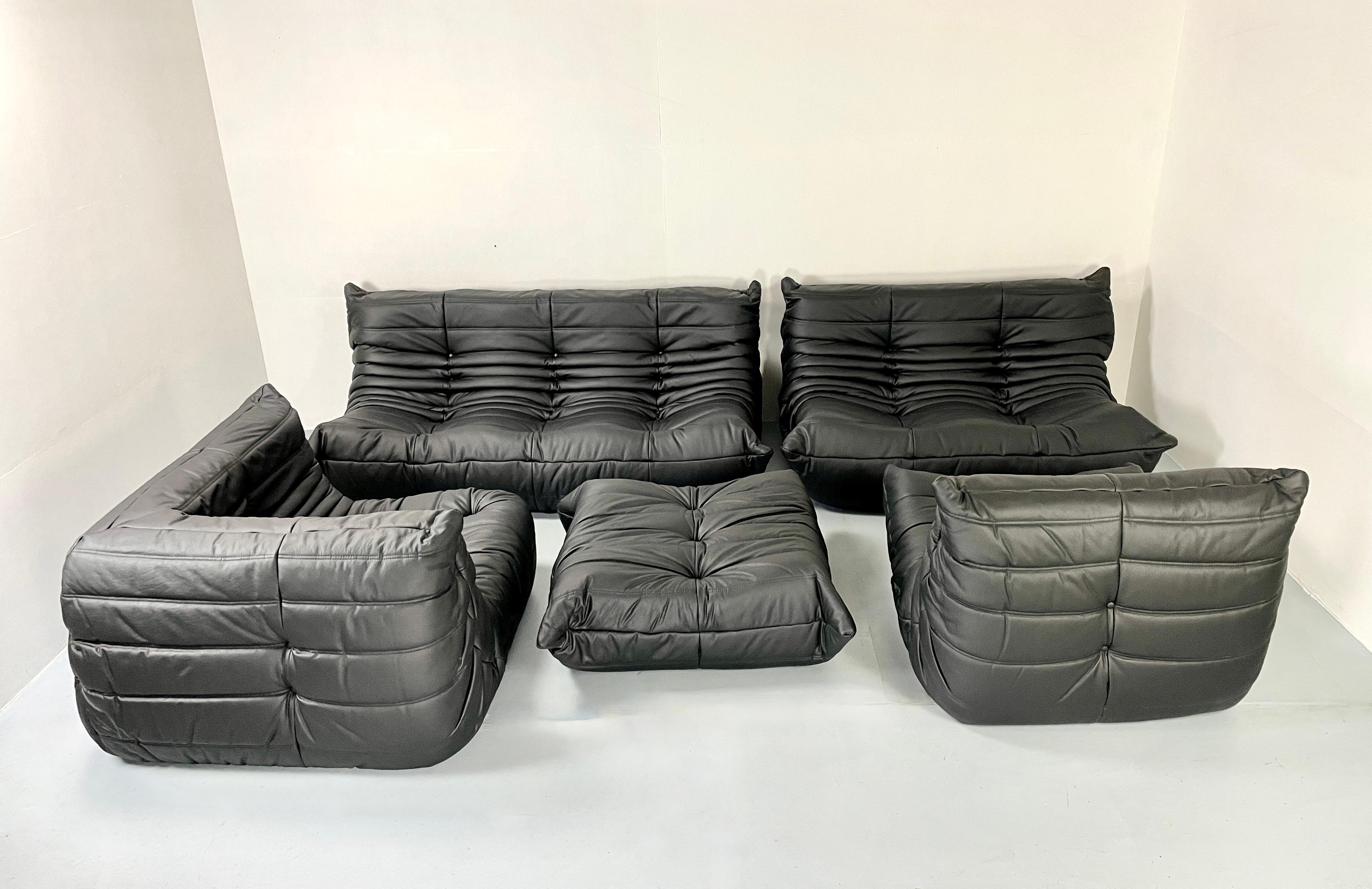 This iconic set offers an unique seating comfort. It is a design by Michel Ducaroy for Ligne Roset. This large modular set is can be configured into one large corner sofa or split for a multitude of seating arrangements. The color of the ensemble is