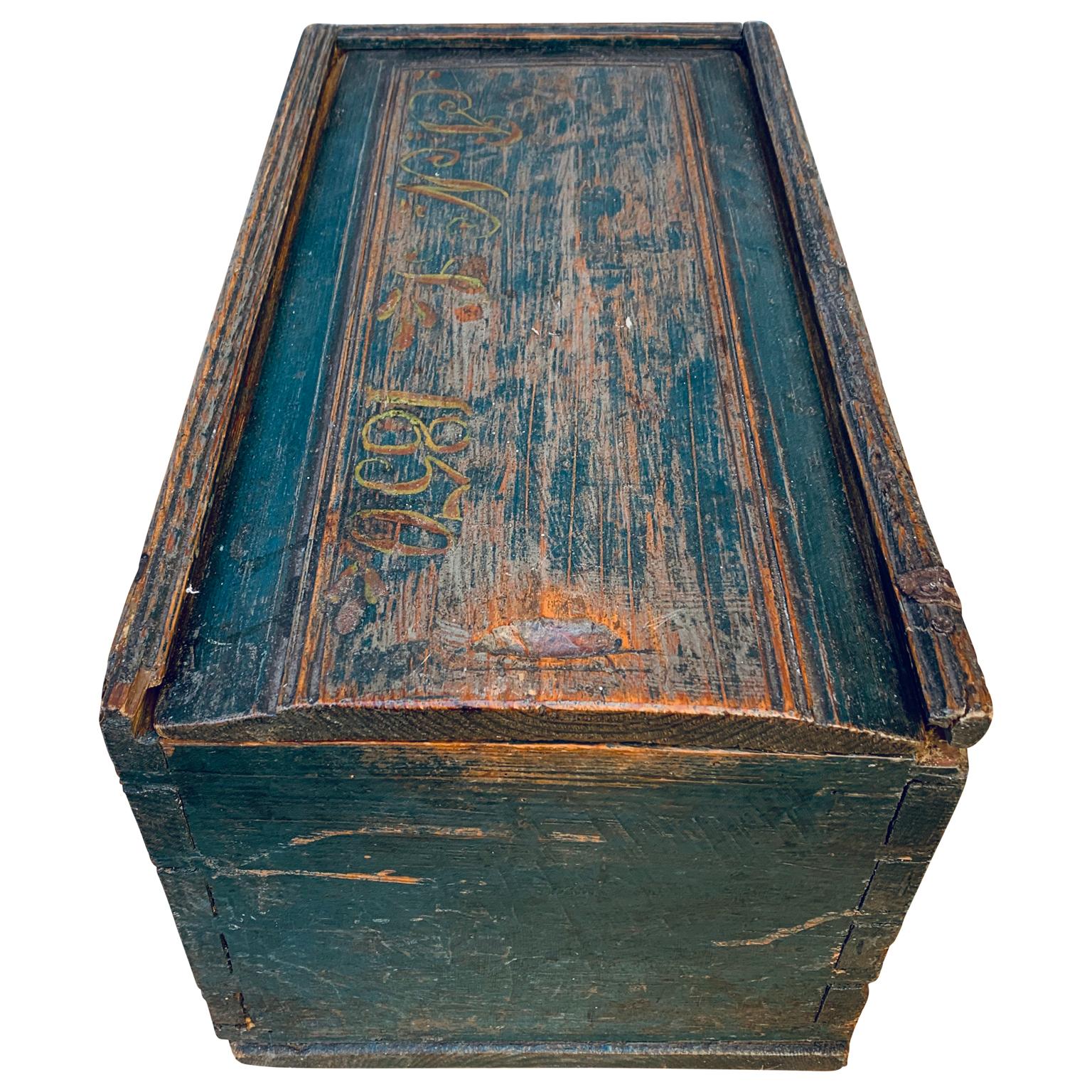 An original blue painted Swedish Folk Art wooden box dated 1852. Signed PNS where the S stands for 