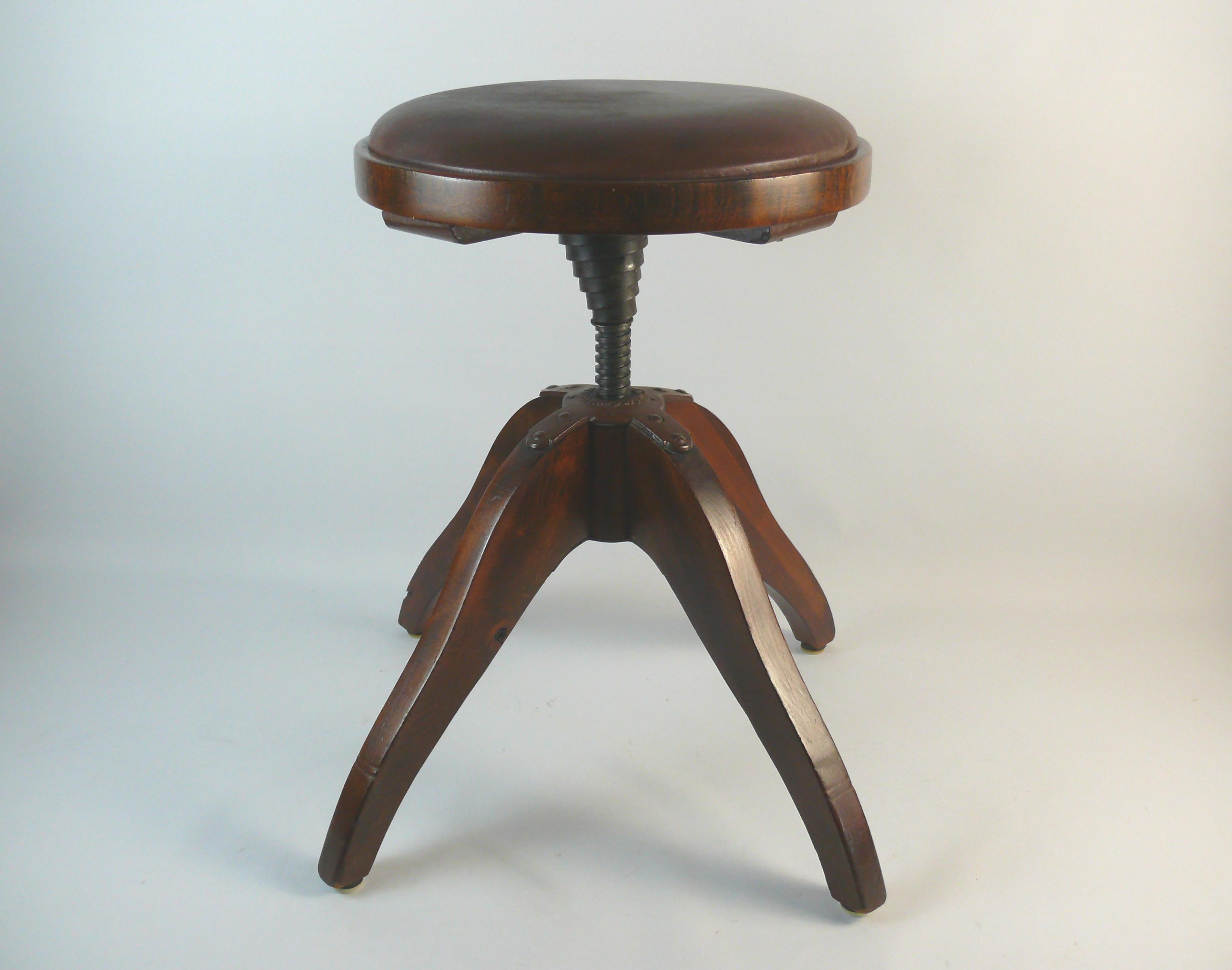 Brown, upholstered and spring-loaded swivel stool from the 1st half of the 20th century by Bombenstabil (Stoelcker KG Ettenheim). The suspension with the inscription: buffer rotation D.R.P. Bombproof. D.R.P. stands for German Reich Patent. The stool