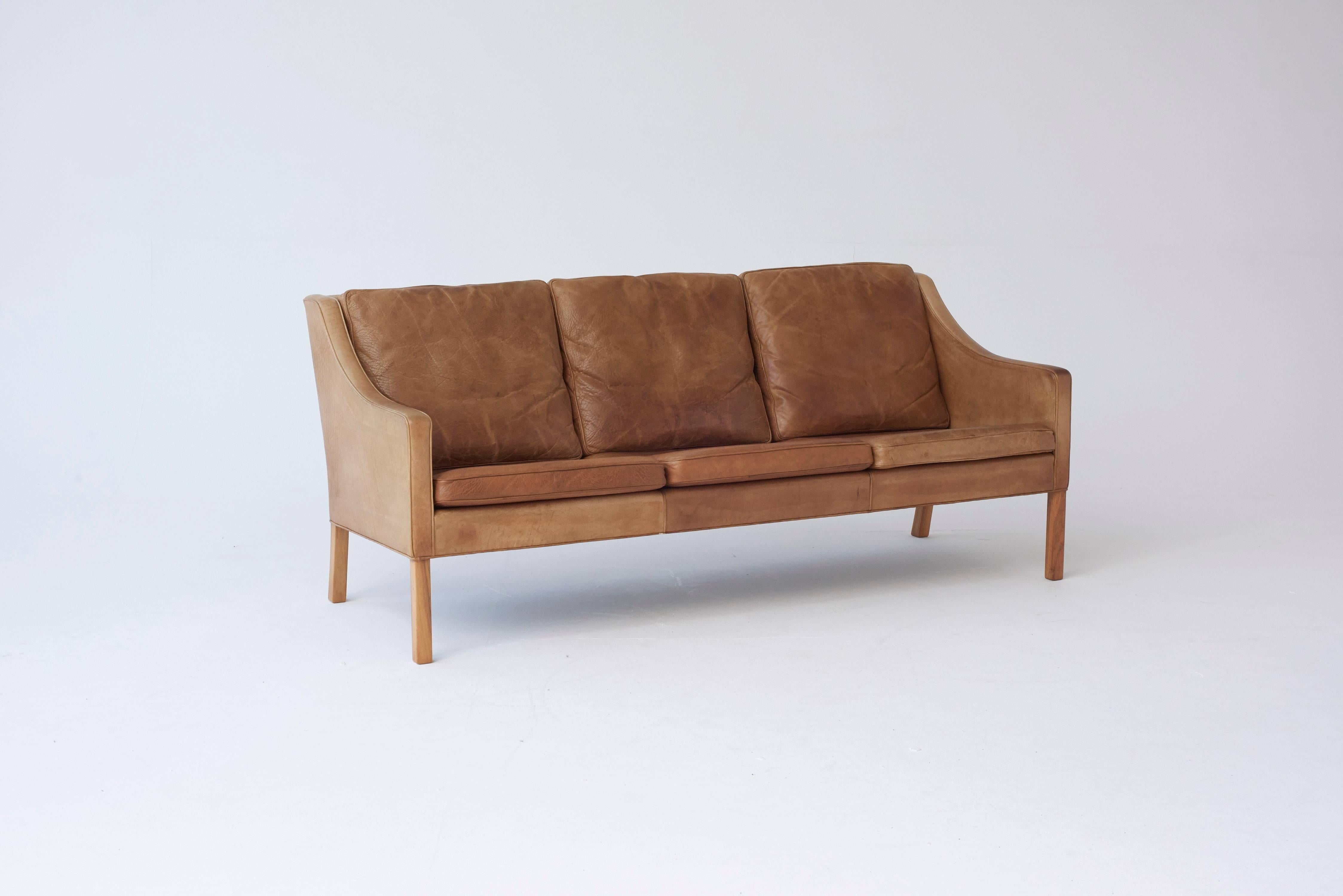 Original three seat sofa designed by Borge Mogensen for Fredericia, Denmark. Designed in 1965. In original condition with a wonderful patina. Ships worldwide - please contact us for options.