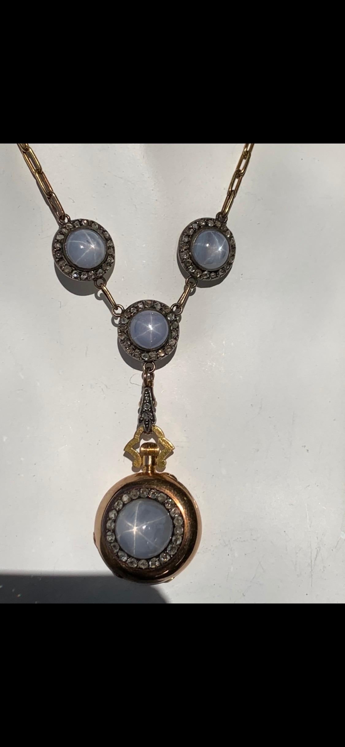 Very Rare Gold Vintage Original Boucheron necklace set with four matching cabochon star sapphires, including the removable matching pendant with a reverse CLOCK. These pieces are each framed with circular cut diamonds. Circa 1900.  

