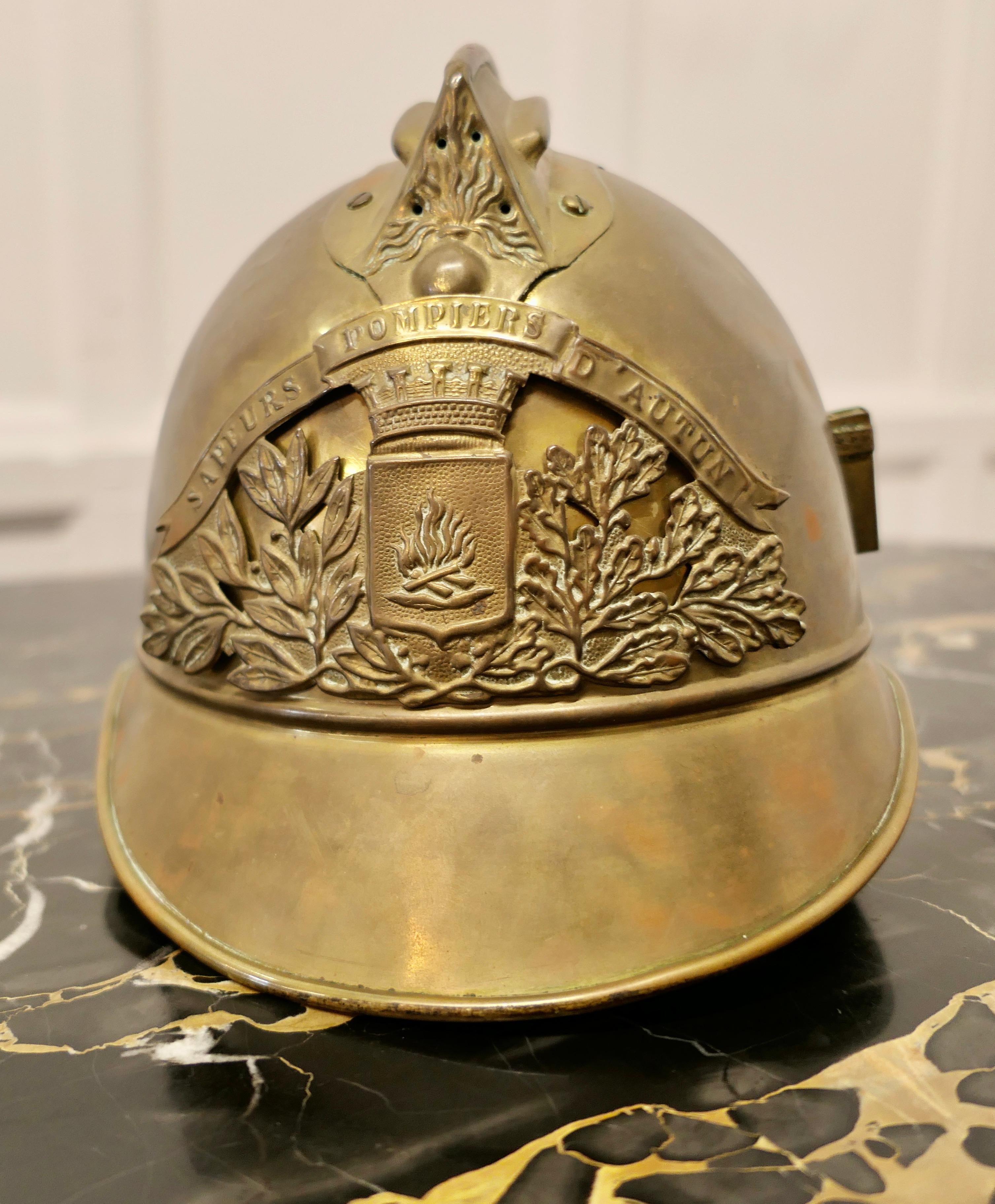 Original brass French Sapeurs Pompiers d’ Autun Fireman’s Helmet.

A good looking piece sadly it has lost its lining but is otherwise complete, a special one for the collector. 
Measures: 8” high, 10” long and 9” wide.
CC208

 