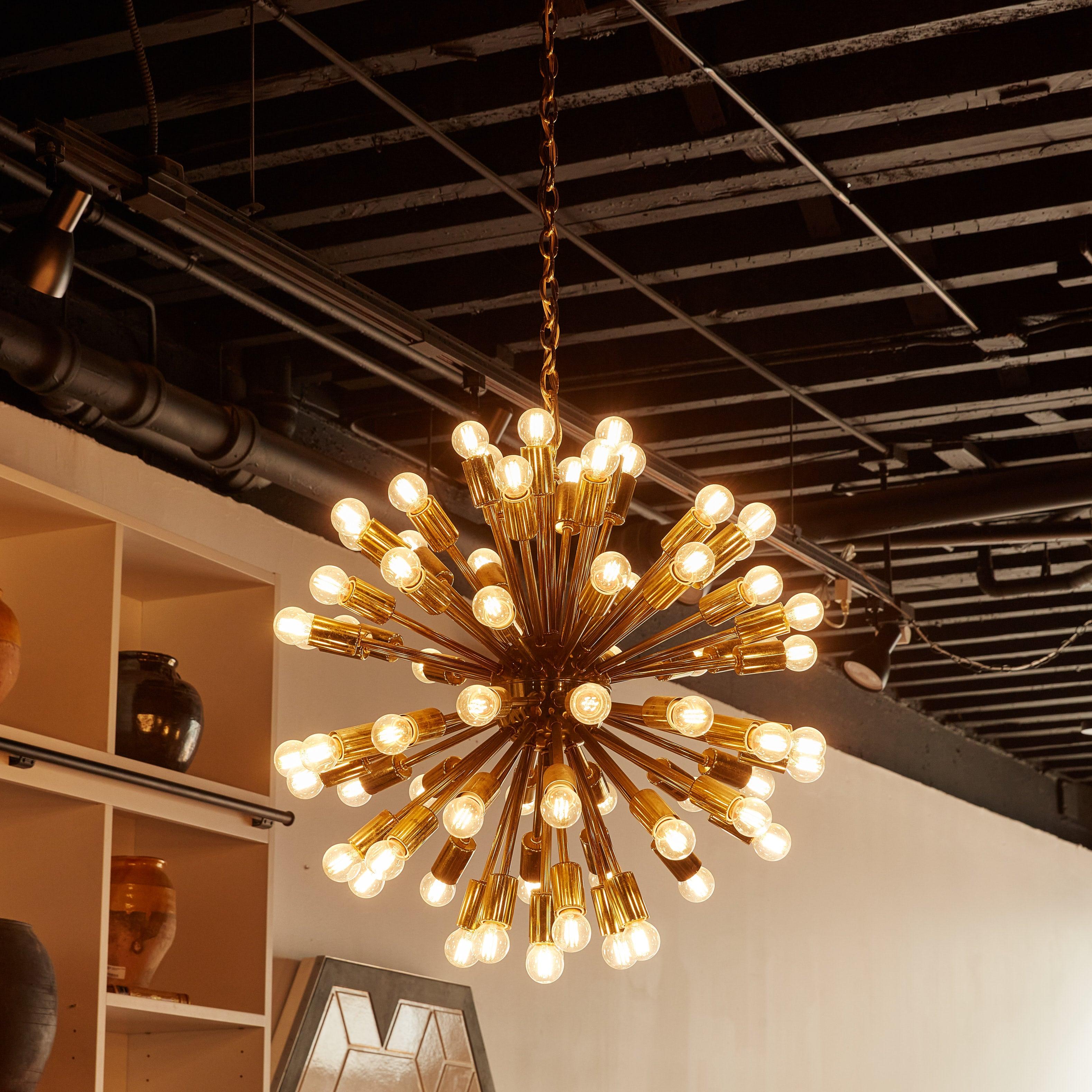 An original 1960s sputnik chandelier featuring a meticulously crafted array of 69 brass arms extending from a central sphere, each tipped with a clear glass bulb. Inspired by the Sputnik satellite in 1957, the arrangement creates a balanced,