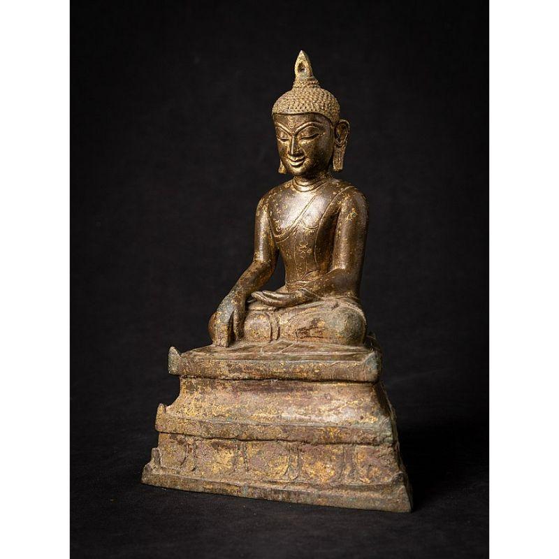 Material: bronze
Measures: 24,4 cm high 
17,1 cm wide and 11 cm deep
Weight: 2.141 kgs
With traces of the original 24 krt. gilding
Bagan style
Bhumisparsha mudra
Originating from Burma
11-13th century
The Buddha has a typical Bagan face,