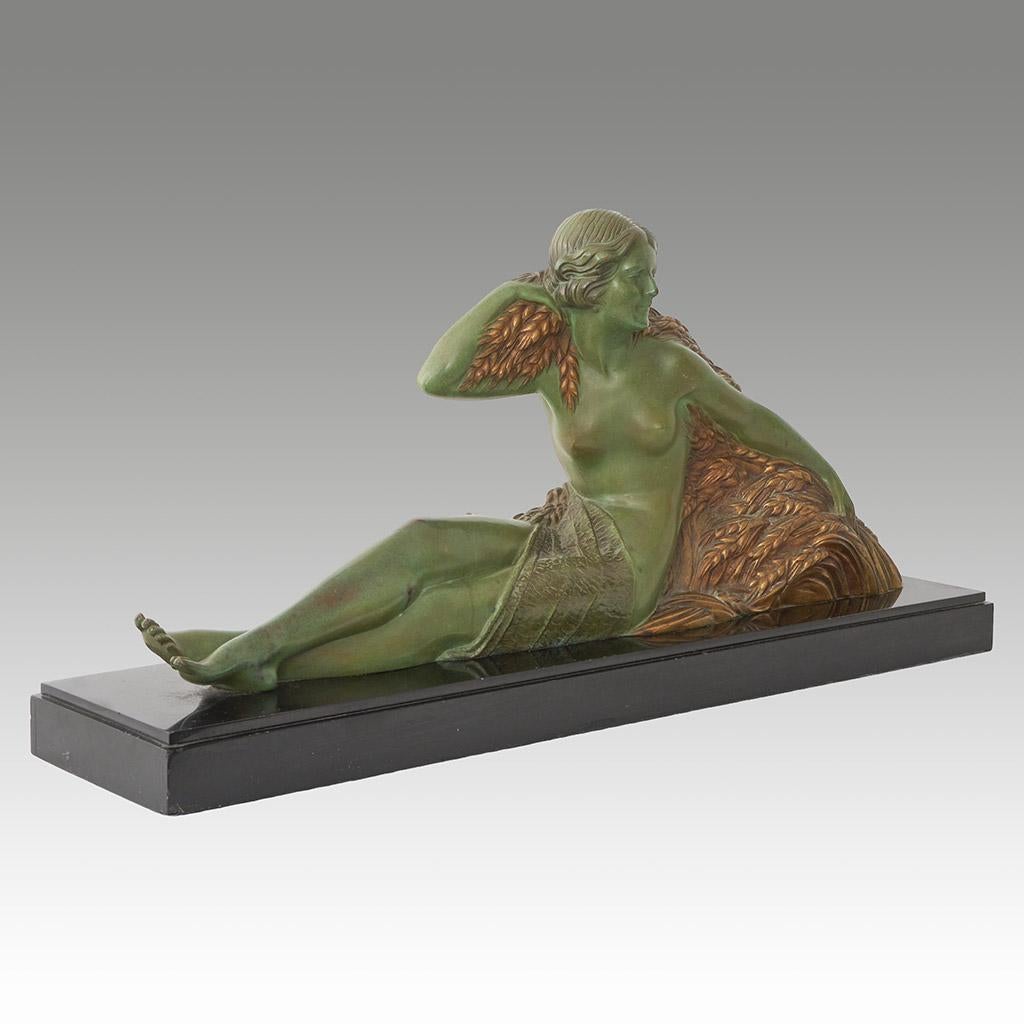 An Art Deco bronze sculpture by Demetre Chiparus (1886-1947) depicting Demeter, the Greek goddess of fertility and the harvest, in a reclining position surrounded by wheat. Signed 'D. H. Chiparus' to bronze and set over original marble base.